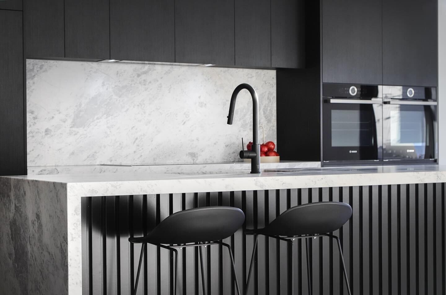Stunning glacier marble from @skpietra on black cabinetry and mat black tapware from @nerotapware