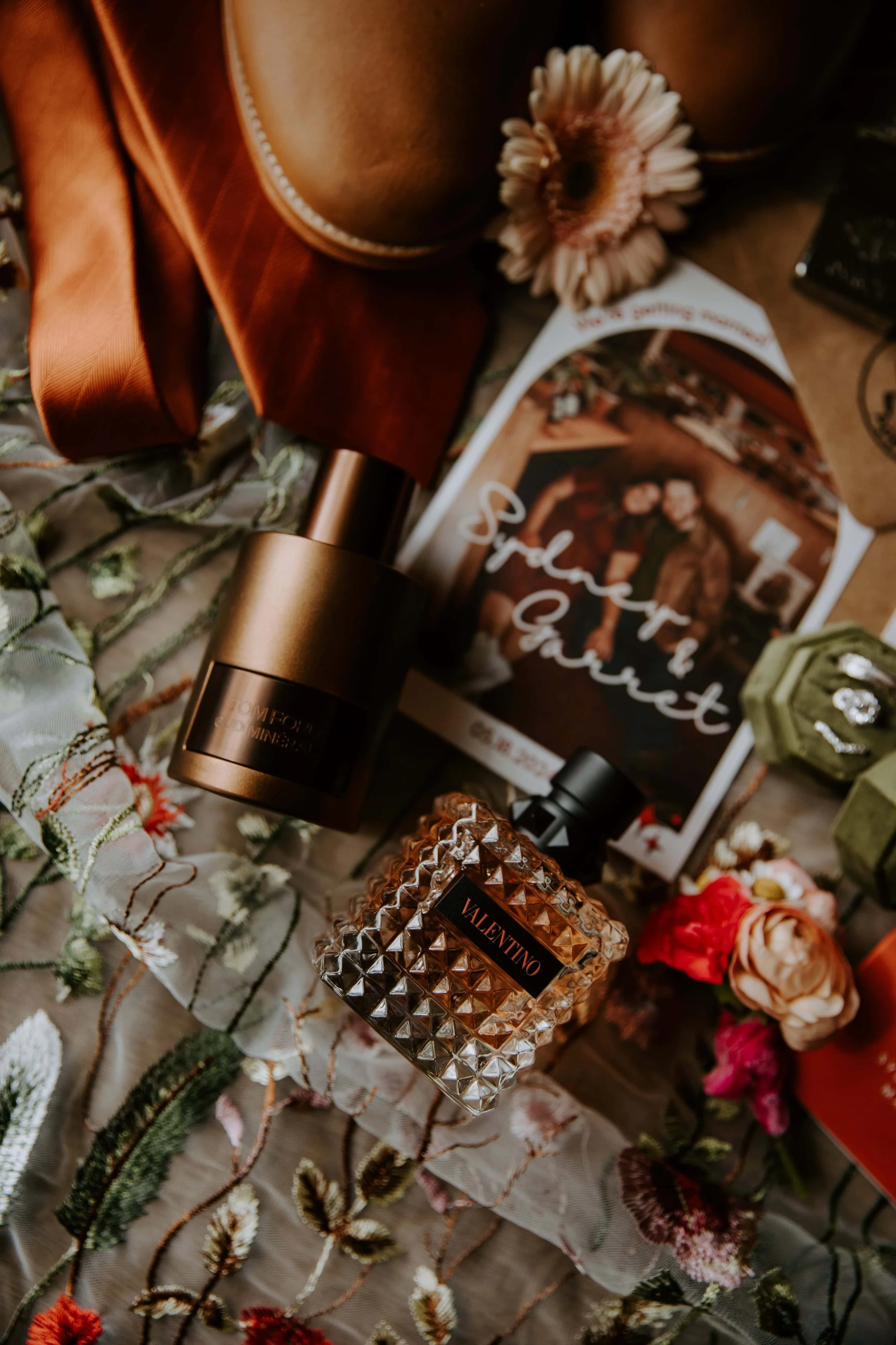 A close up of the bride and grooms perfume and cologne.