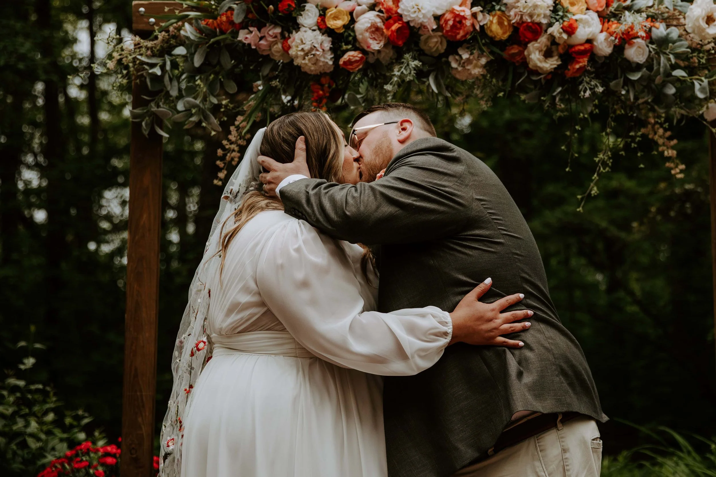 The bride and groom share their first kiss during their ceremony.