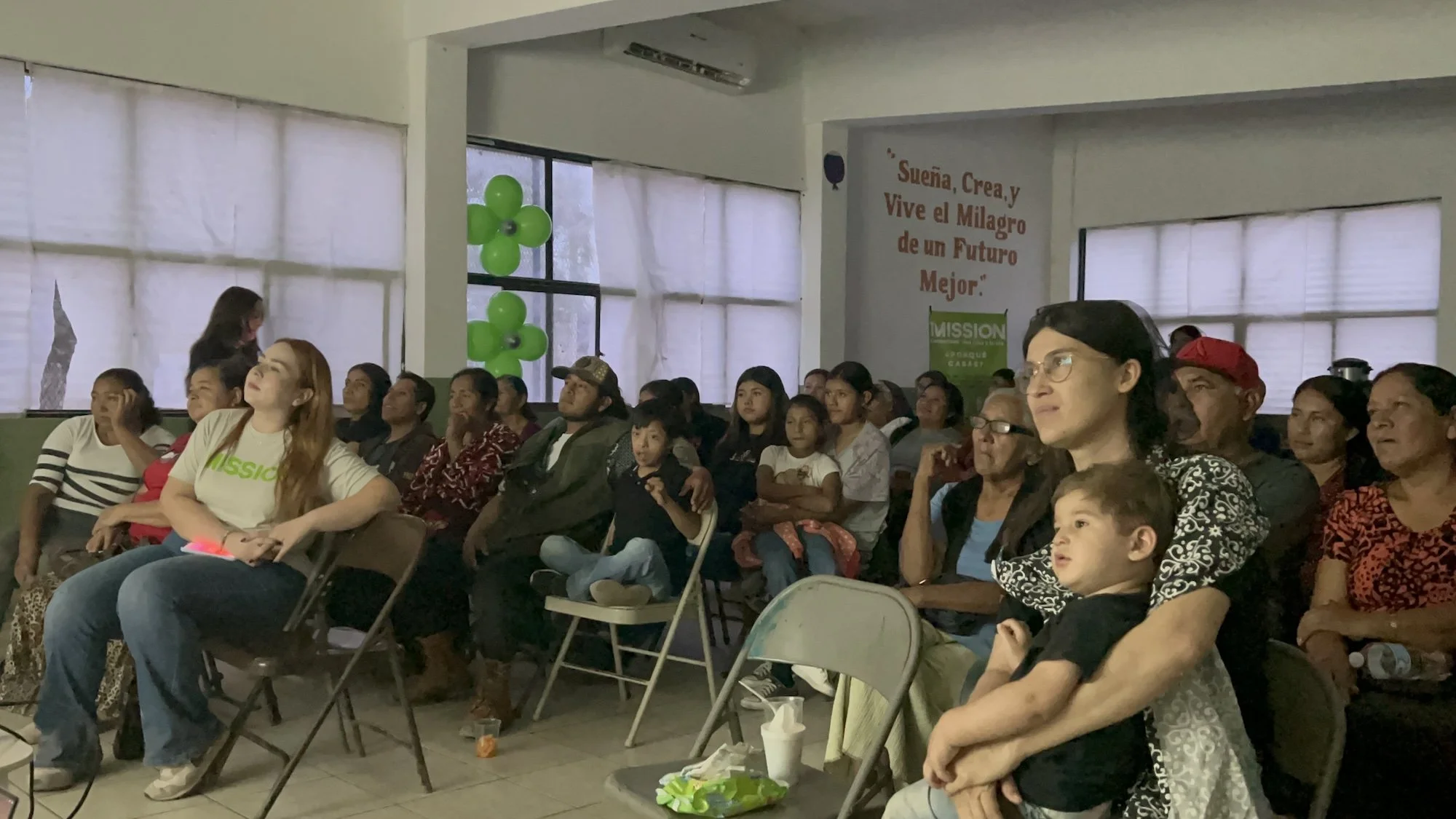 Community members watch the film screening of "This is Home"