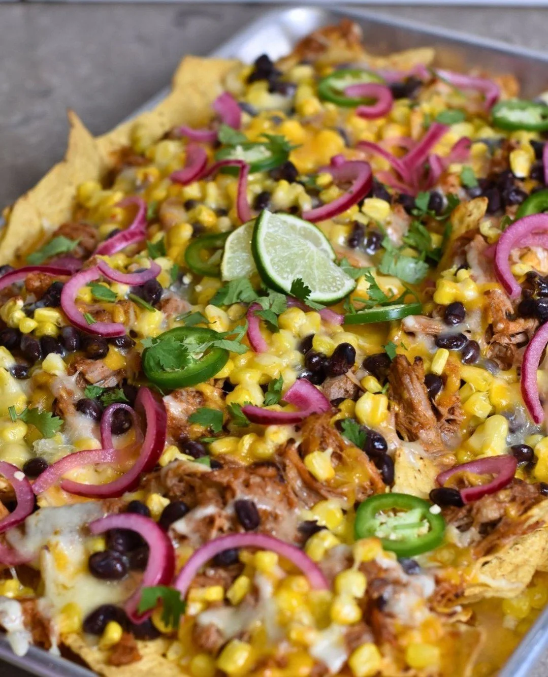 This is your warning: set these down and they WILL disappear.⁠
Crunchy chips + smoky pulled pork + melted cheese = instant chaos at the snack table.⁠
⁠
👀 Who in your family always shows up FIRST for the food? Tag them.⁠
⁠
Recipe in bio.⁠
#CookoutFoo