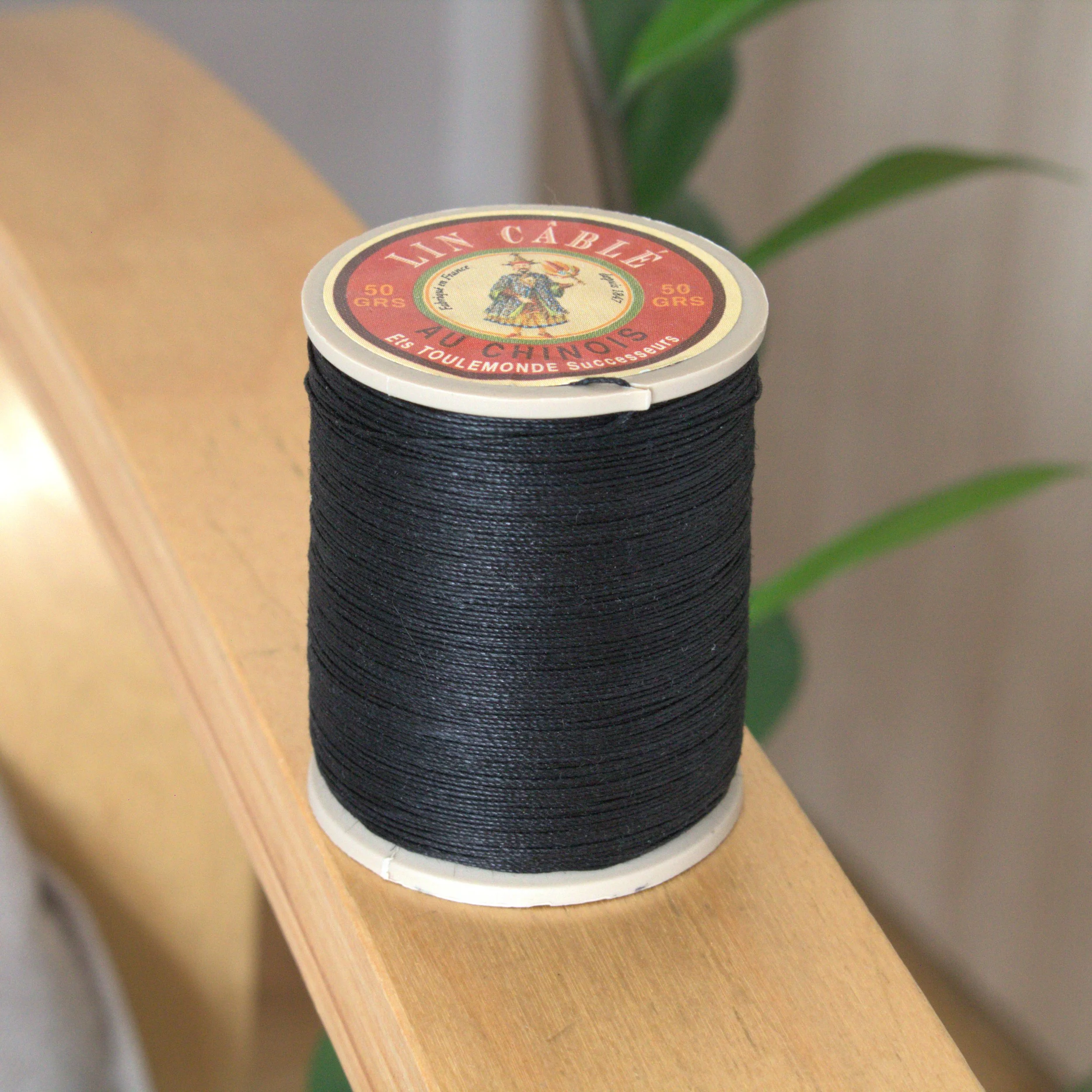 Cable linen thread 632 spool 180 - Black.  Black color French linen thread at 0.5 thickness. Great for leathercrafting, book biding, jewelry making.