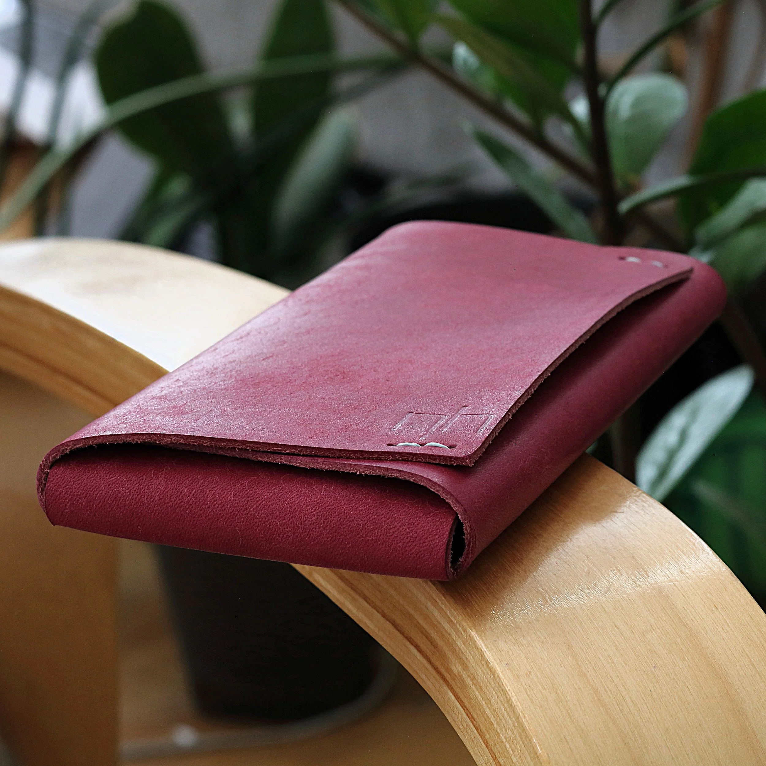premium pink Italian leather phone sleeve case for Apple iPhone. minimalist, compact folded design handmade iPhone case. Handmade in Europe