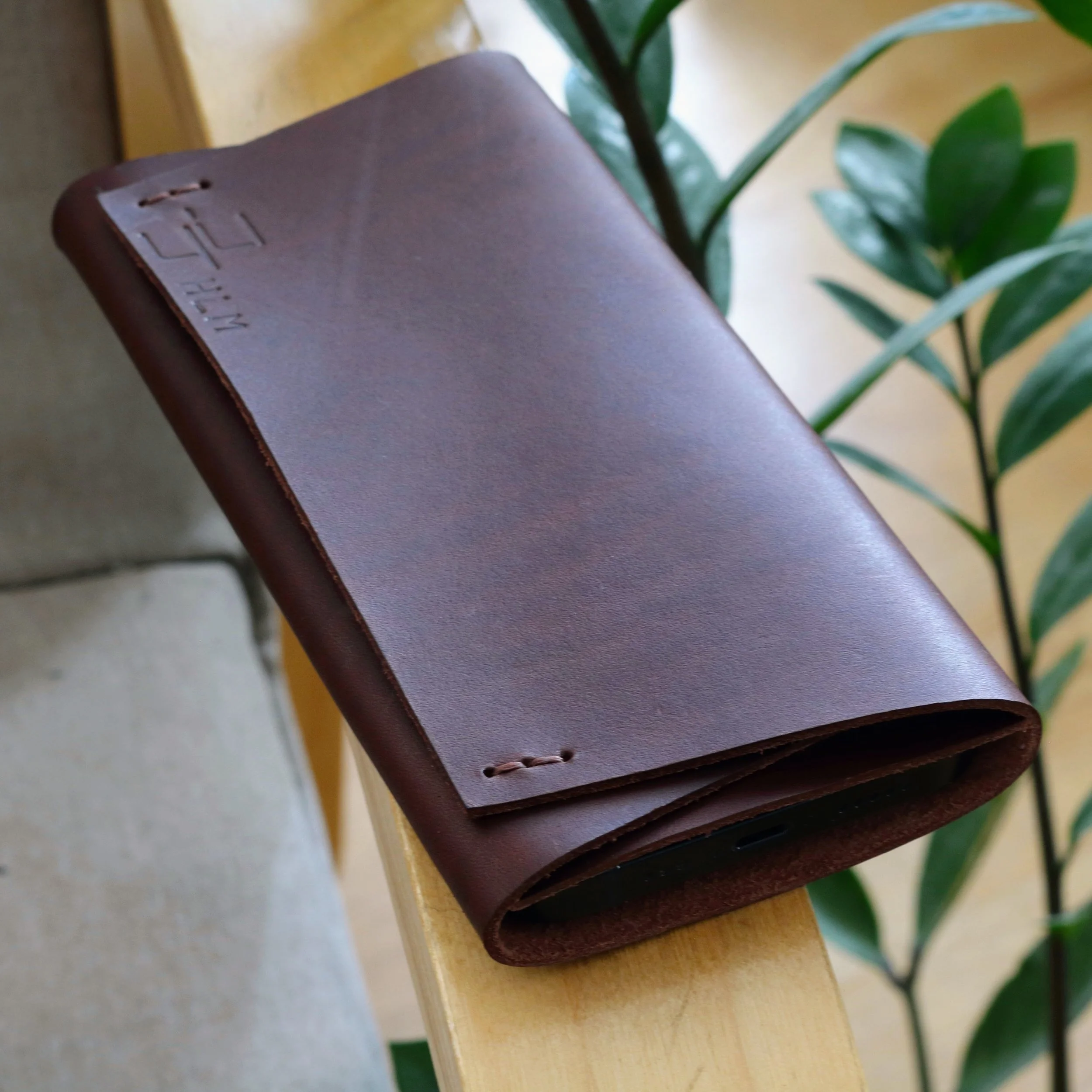 Top view of smooth dark brown full grain leather Z Fold 8 Ultra compact pouch case with brown stitching.