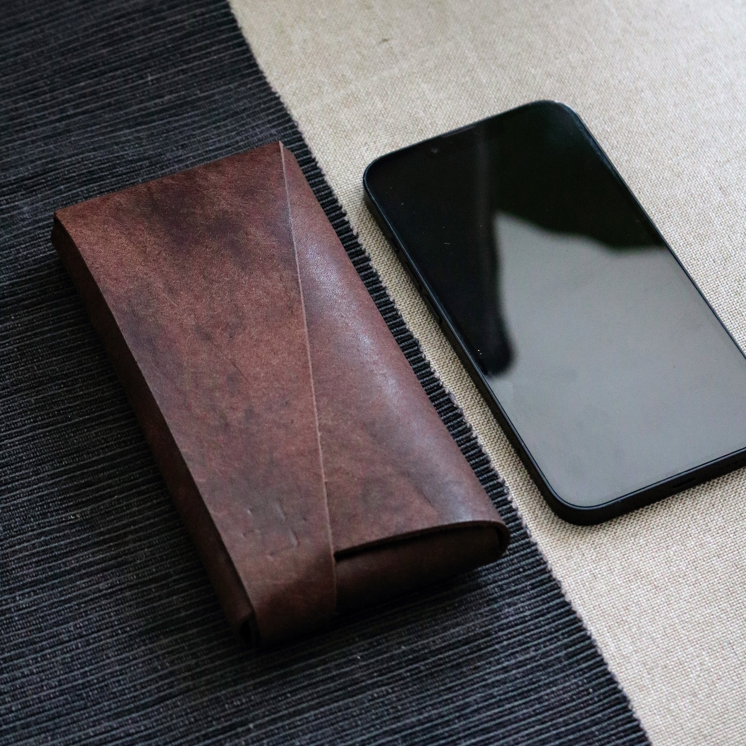 Stylish brown leather cell phone phone cover with card holder for iPhone 15 Pro Max. made from high quality Italian leather