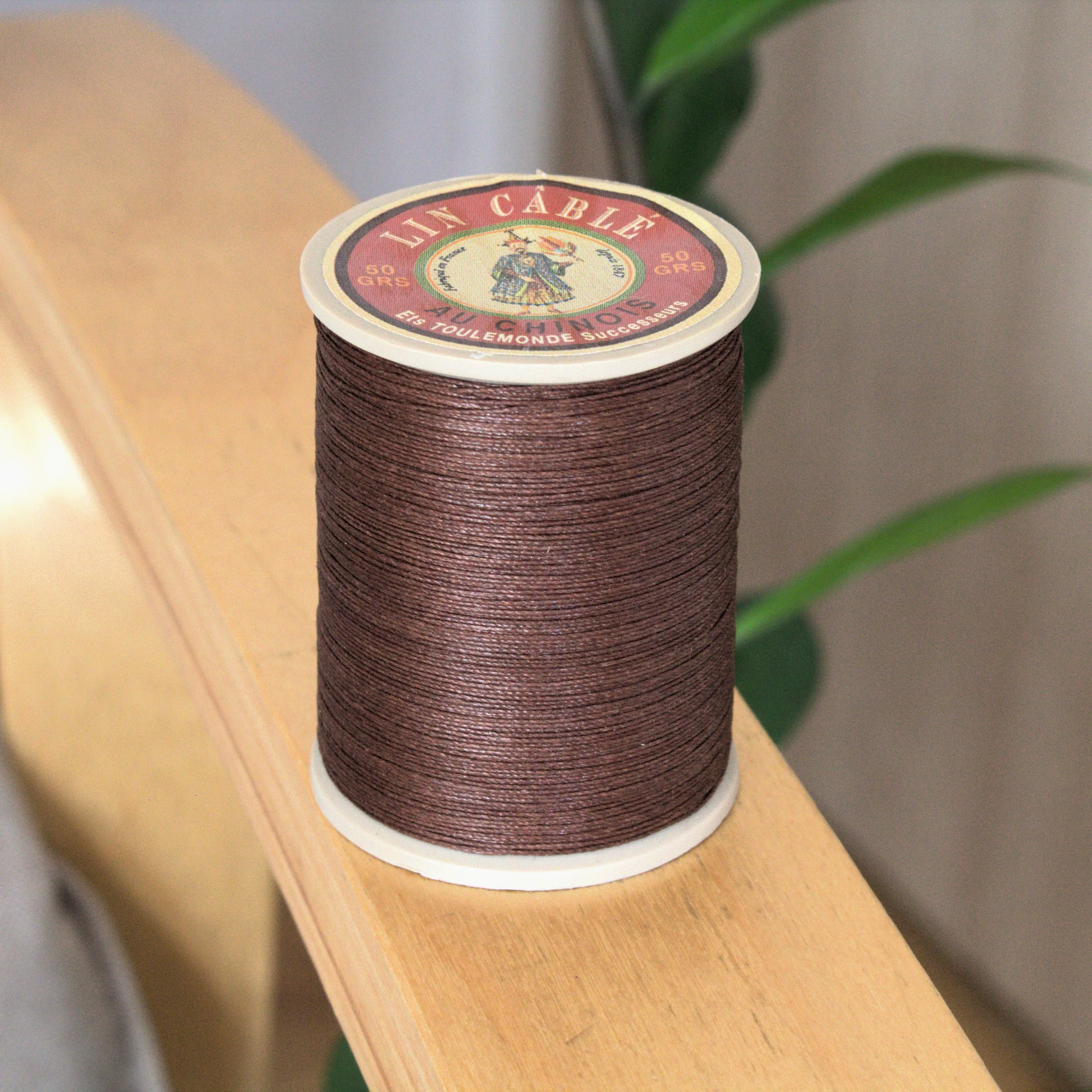 Fil Au Chinois Cable linen waxed thread 632 spool 480 - Chocolate. Brown color French linen thread at 0.5 thickness. Great for leathercrafting, book biding, jewelry making.