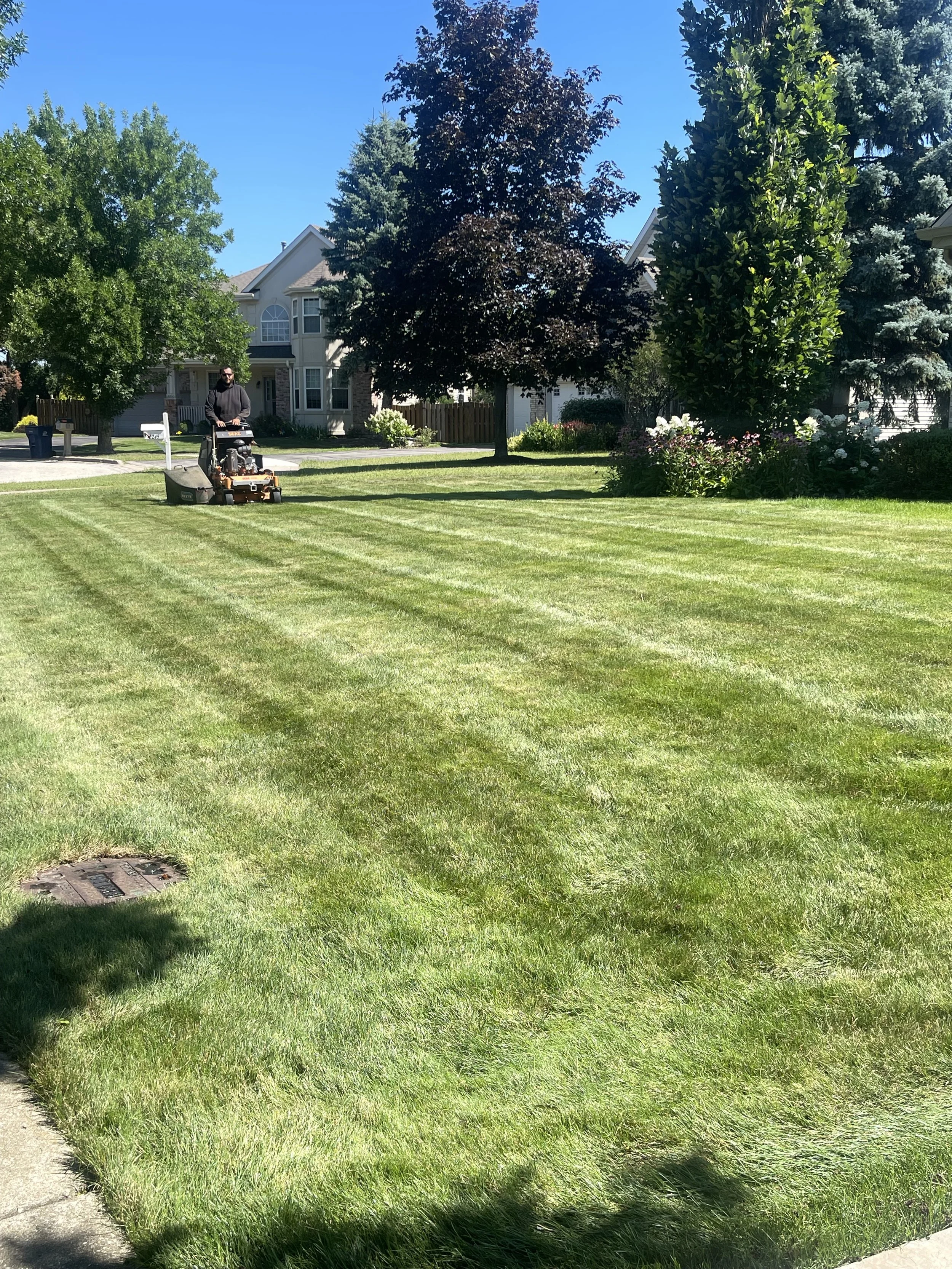 Evo Lawn and Landscape mowing a residential customer lawn in Gurnee Illinois