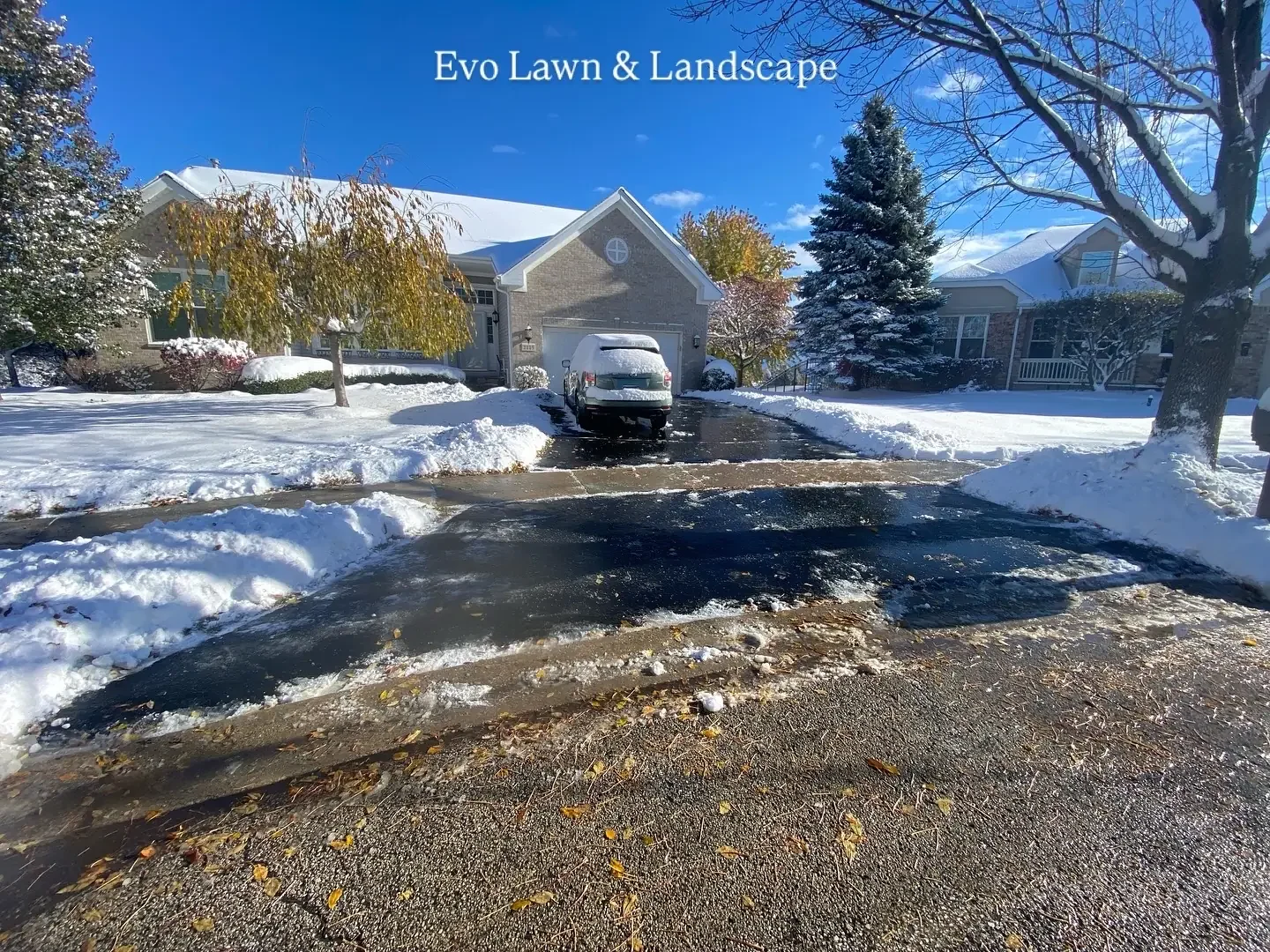 Residential driveway cleared after snowfall by Evo Lawn and Landscape in Lake County Illinois