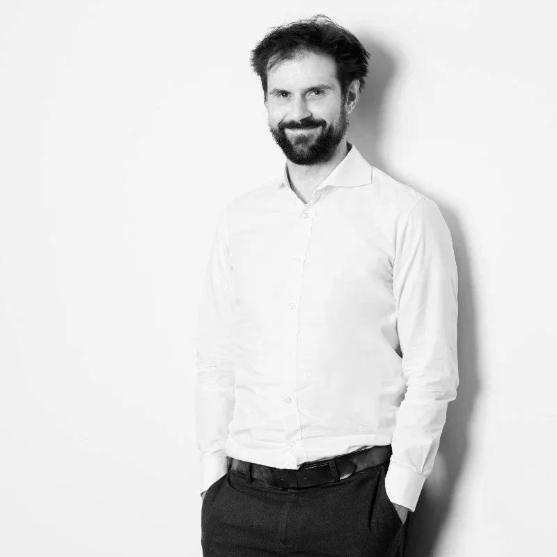 Headshot monochrome image of Tobias Lorenz