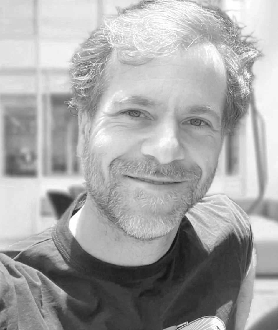 Headshot monochrome image of Konstantin Preugschat