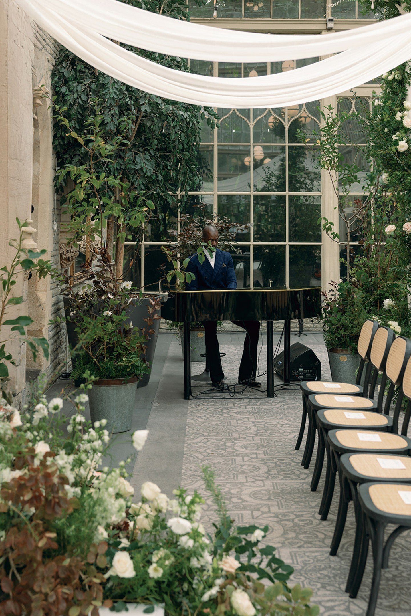 The transformation of this orangery space at Tortworh Court was nothing short of extraordinary. Carefully considered accents of black, in the form of our Felix chairs, soft draping cascading from the ceiling and an abundance of garden florals which c