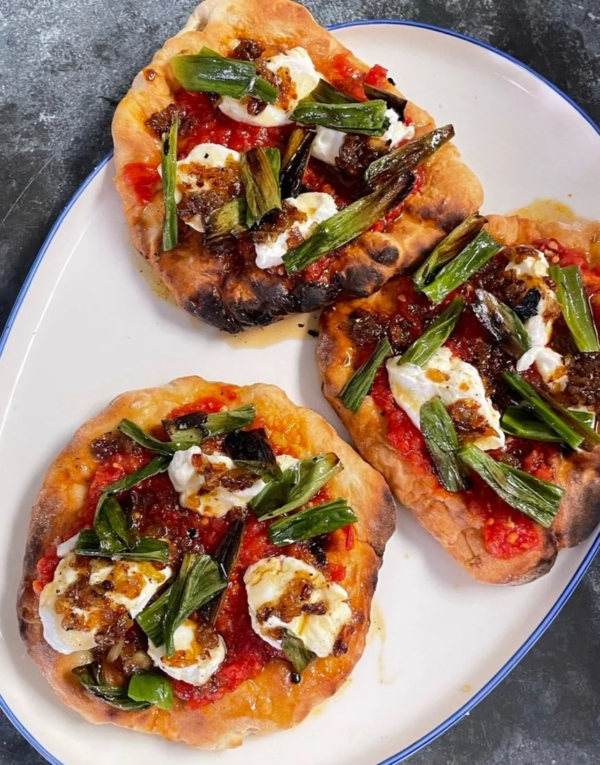 Yoghurt flatbreads with grated tomato salsa, chilli syrup and curried onions