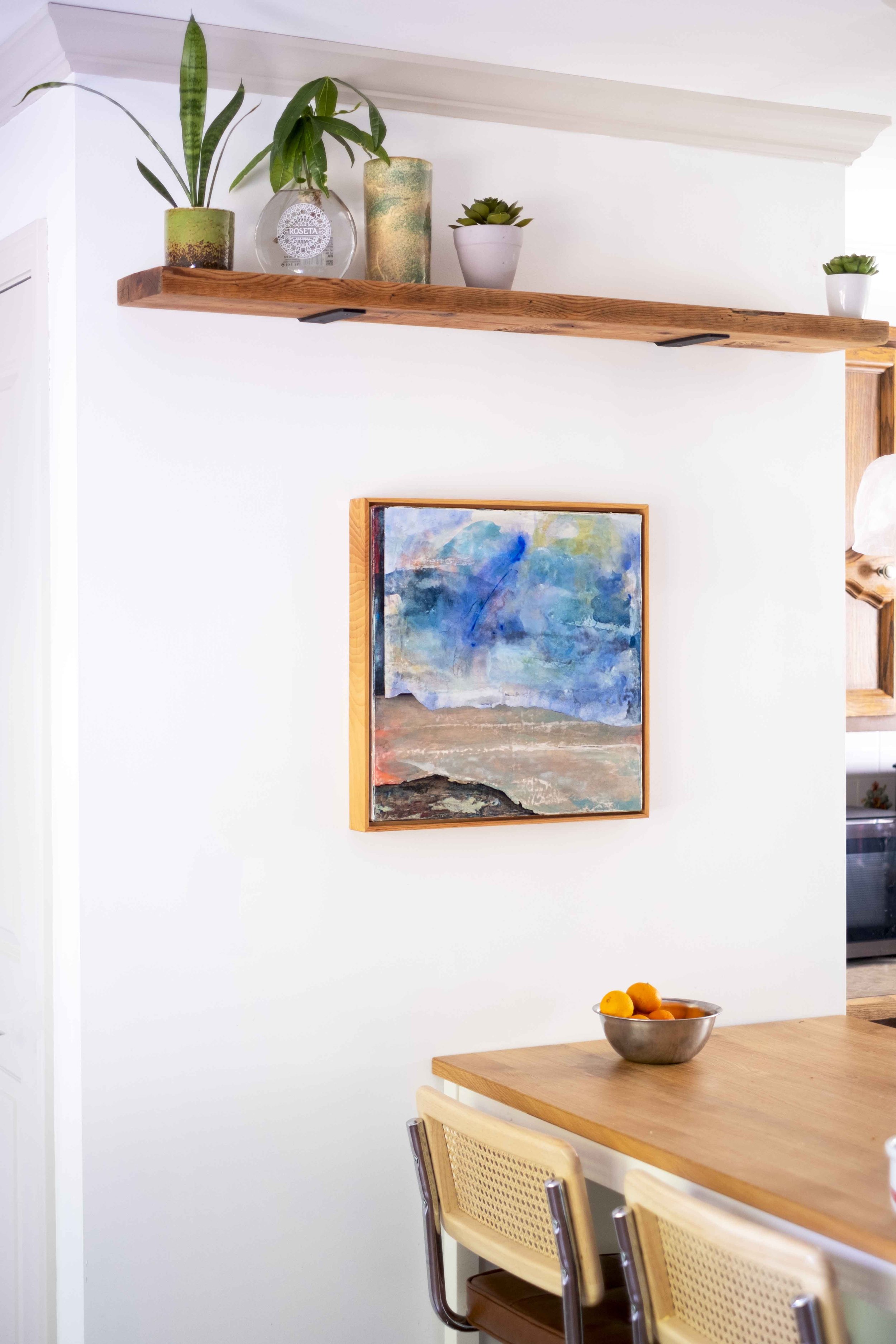 Blue abstract painting on kitchen wall