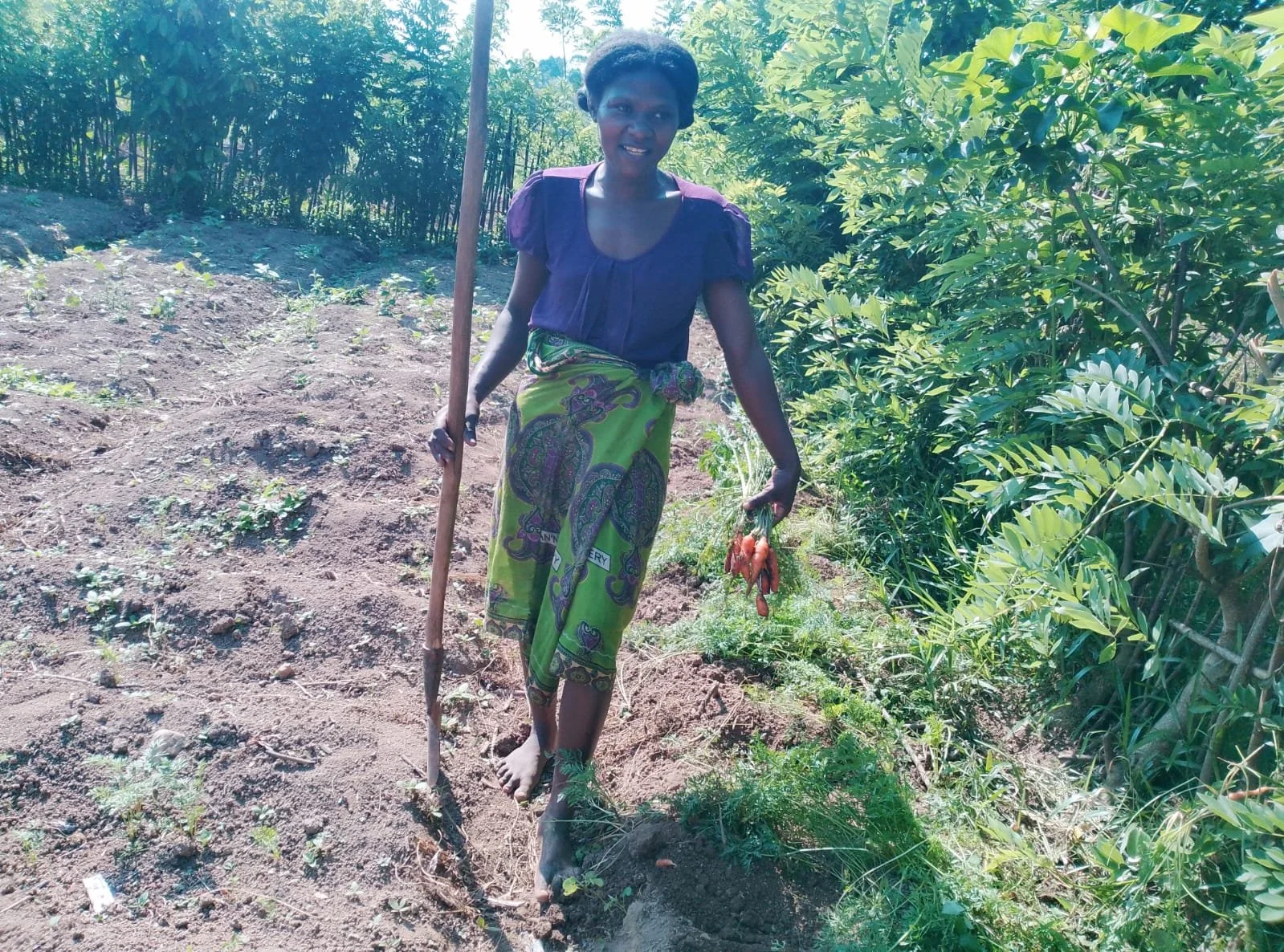 Marceline on her farm plot