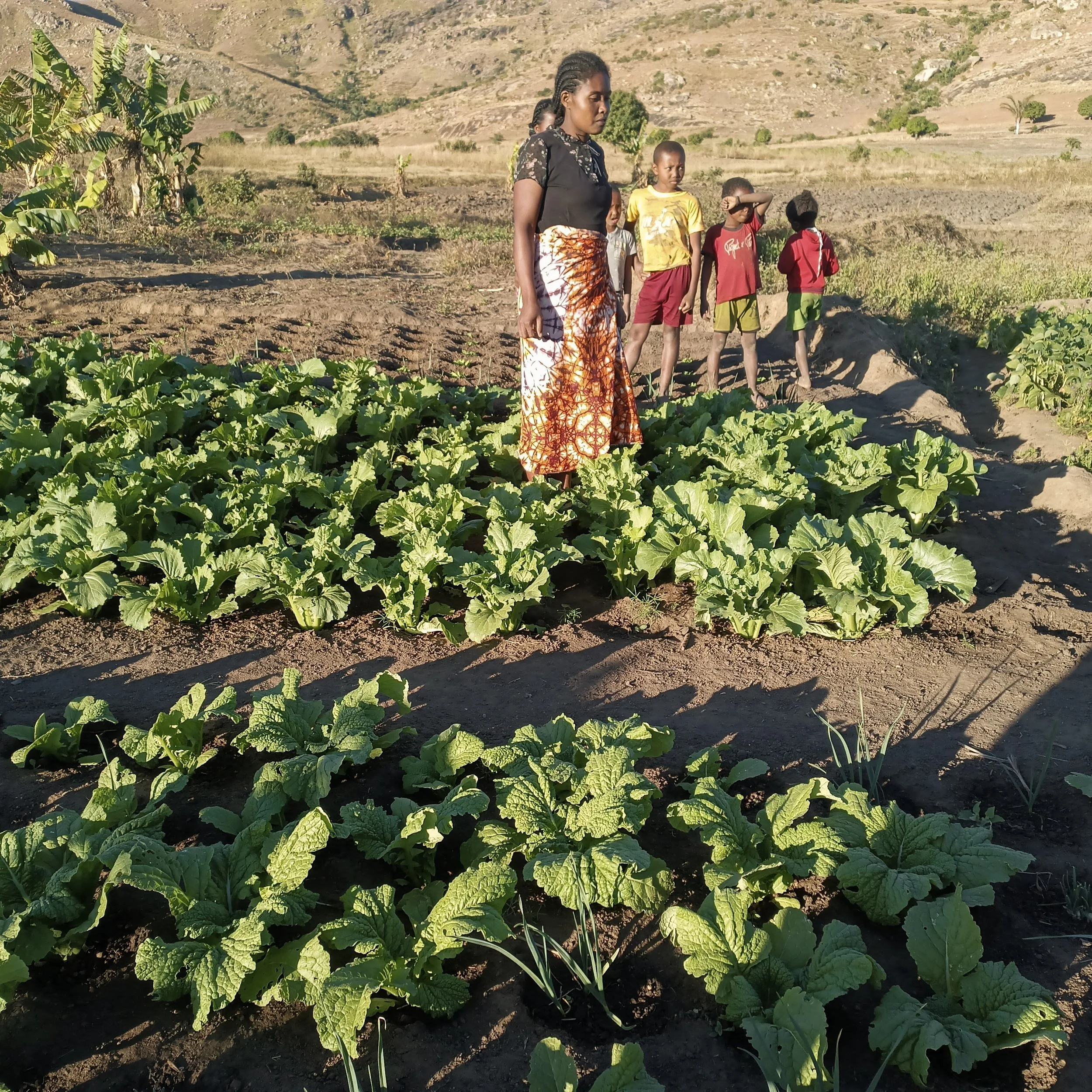 Hanitra and her children on their farm plot