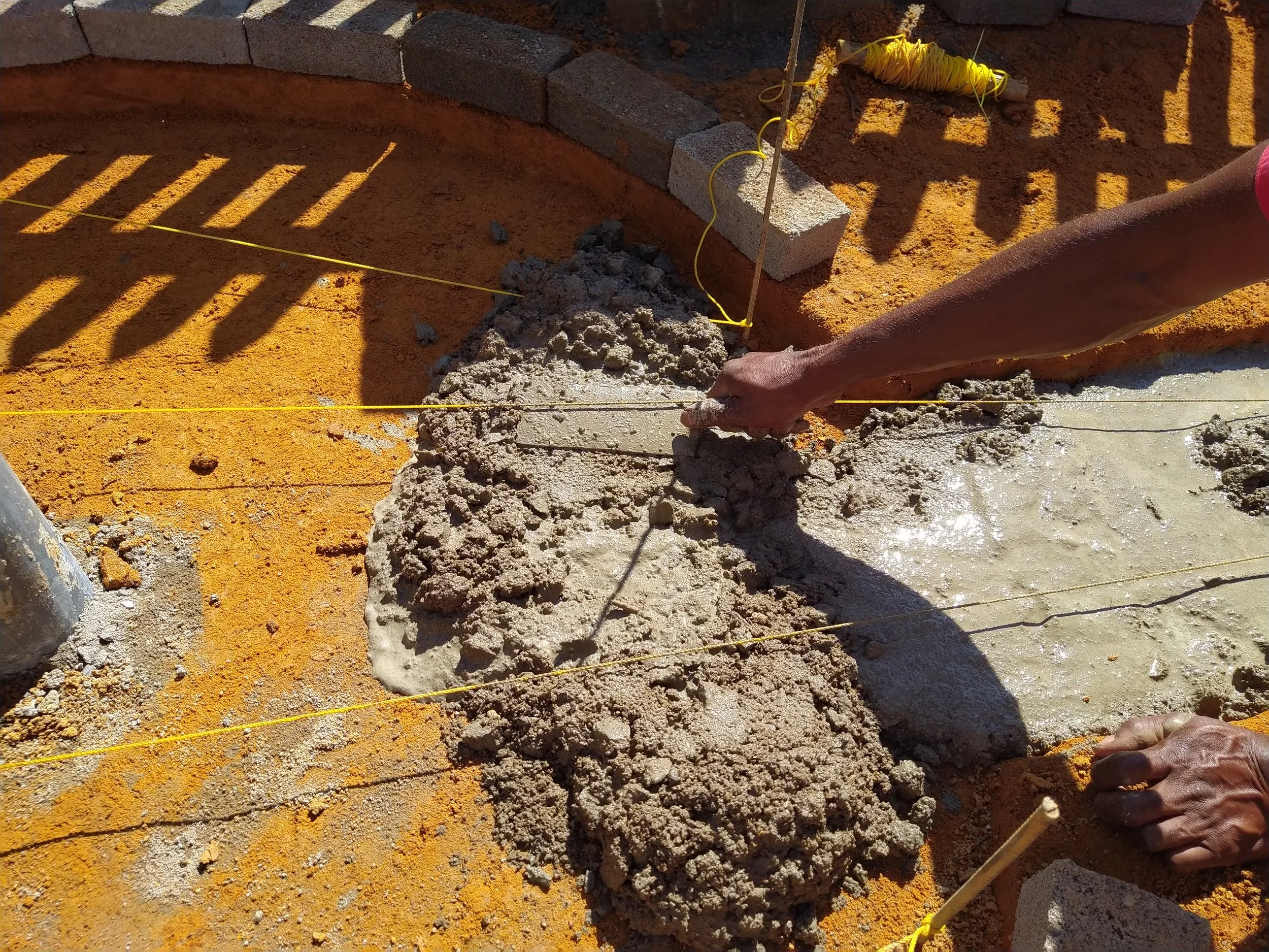 Constructing the sanitary apron around the canzee-pump to ensure cleanliness of the water point