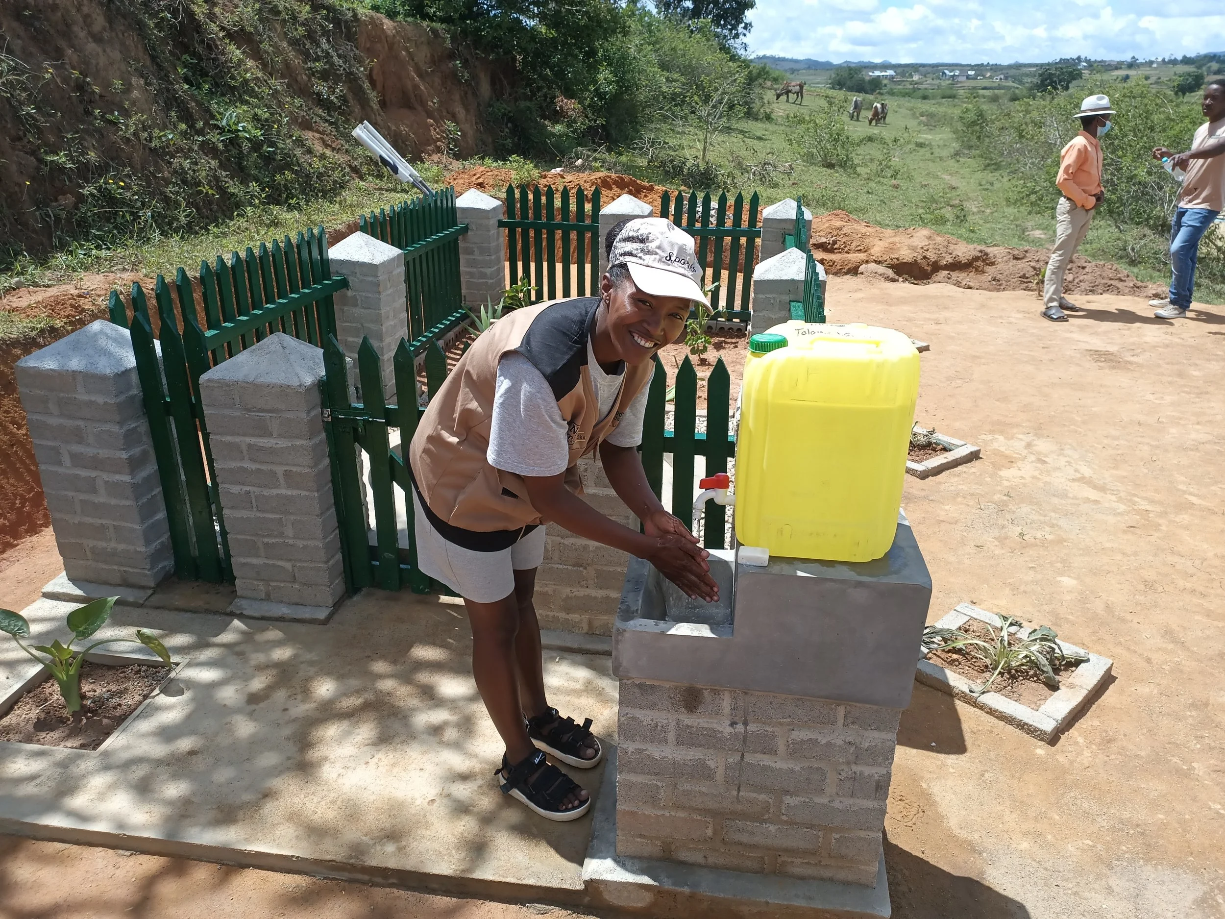 Rina our School Feeding officer enjoying the new handwashing station at the Tolongoa Nord borehole