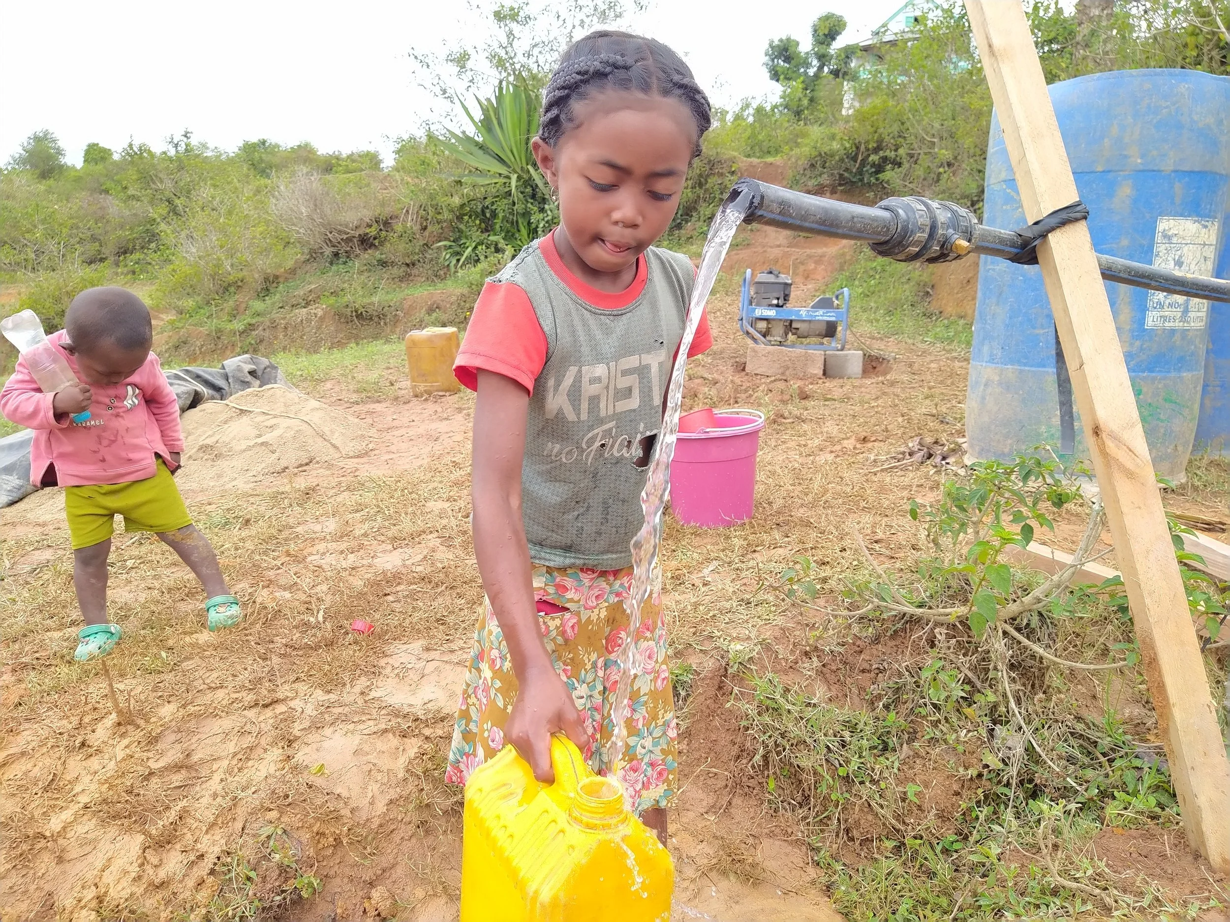 Gathering clean water for the first time during the construction phase