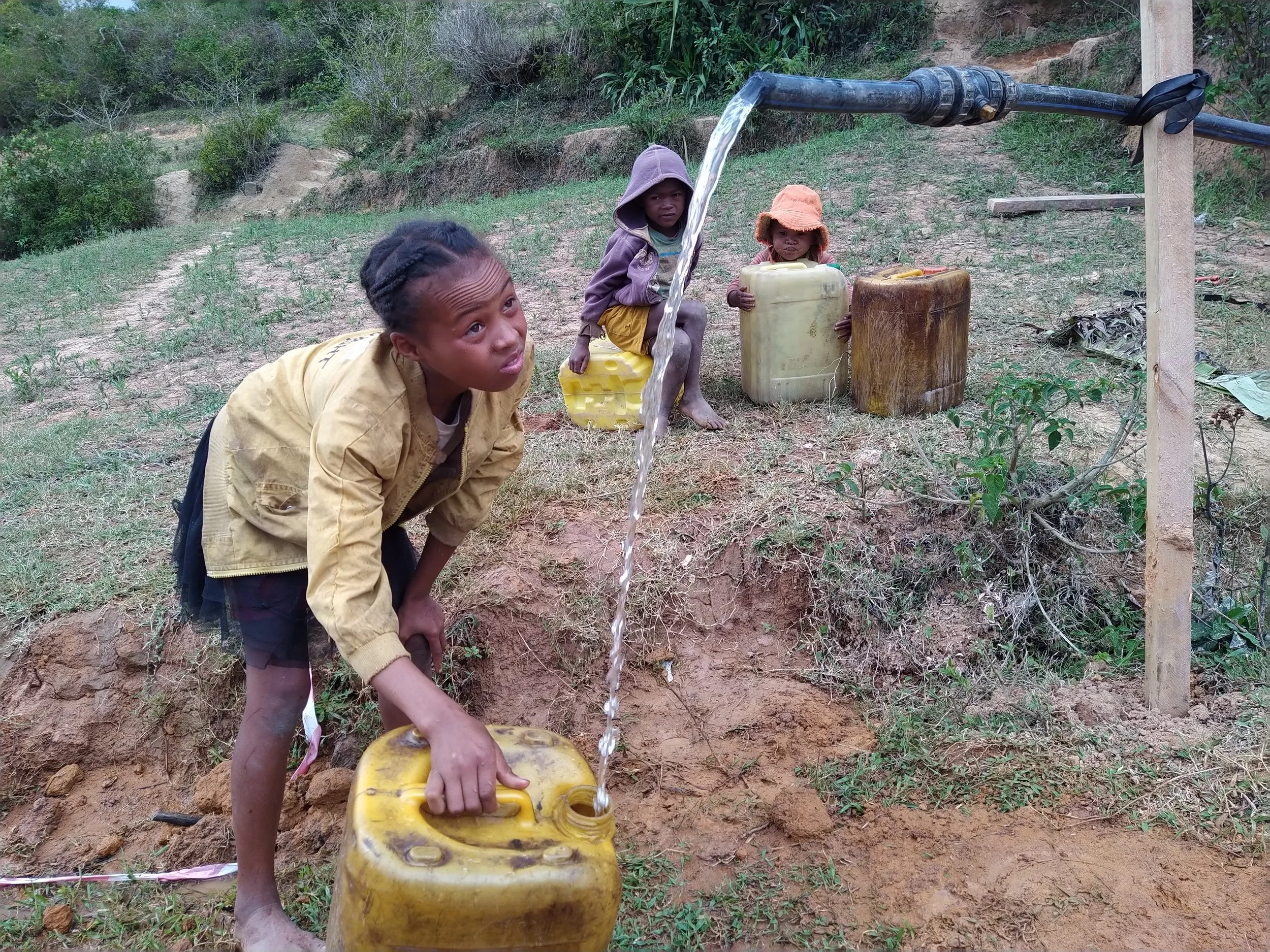 Gathering clean water for the first time during the construction phase