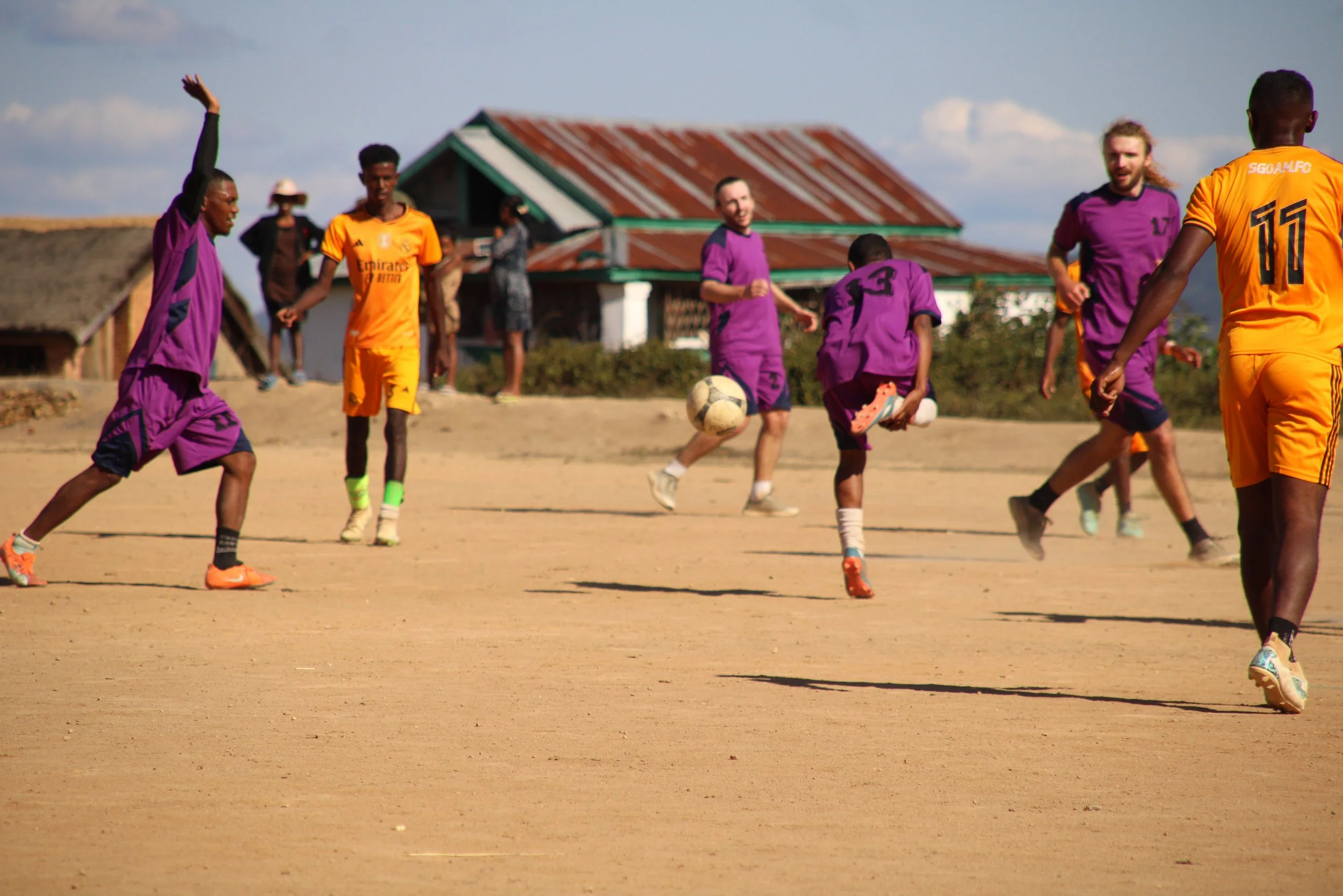 Friendly football match with the local youth team