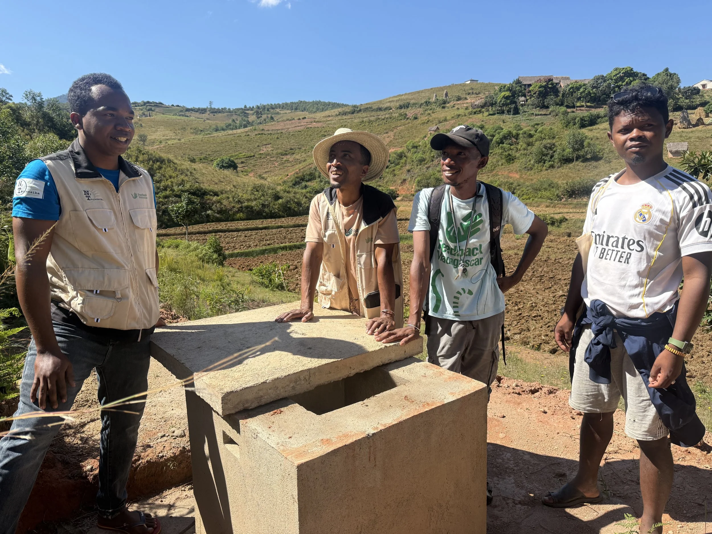 Team showing the solar pump borehole in Itaolana