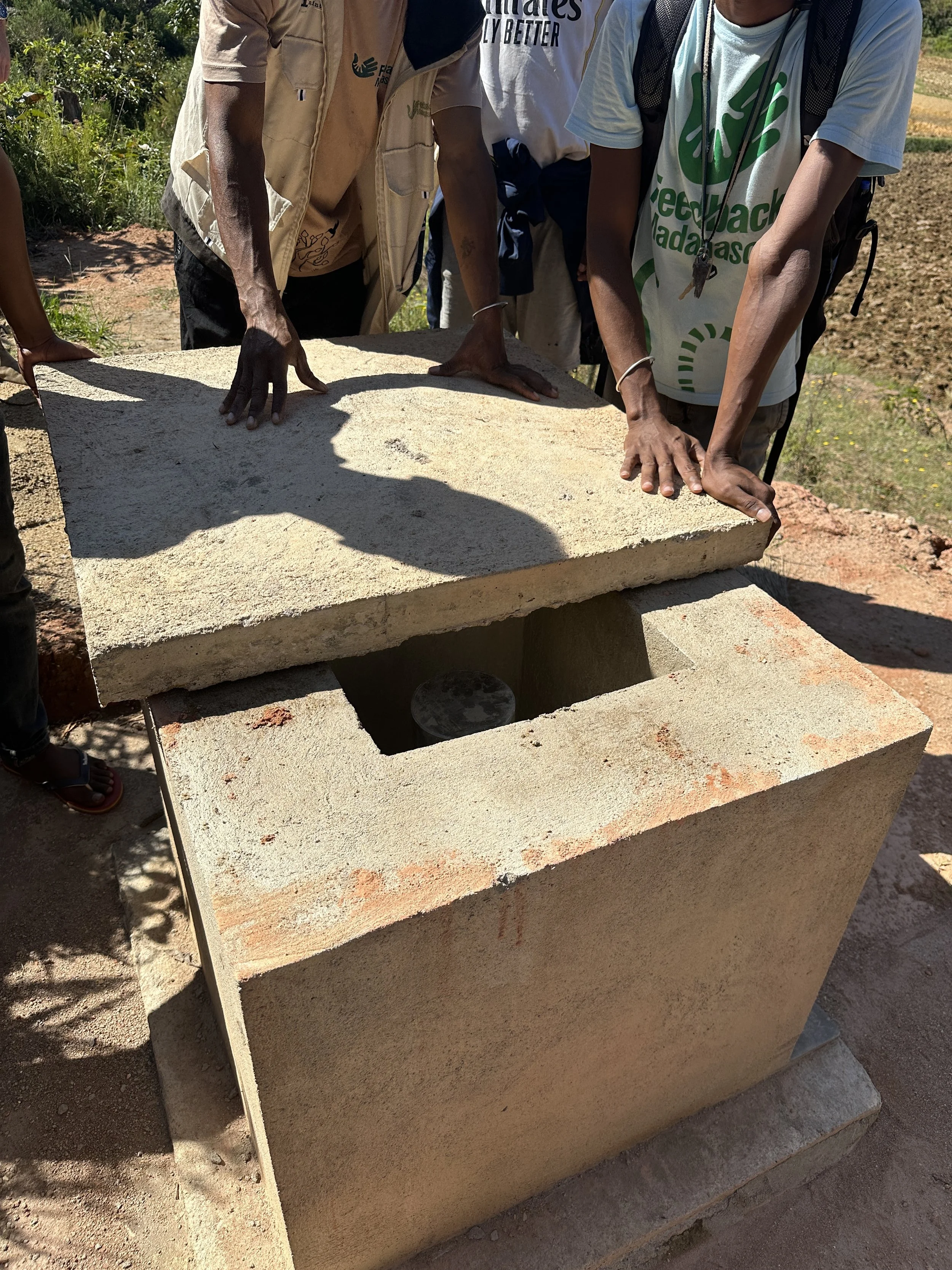 Team showing the solar pump borehole in Itaolana