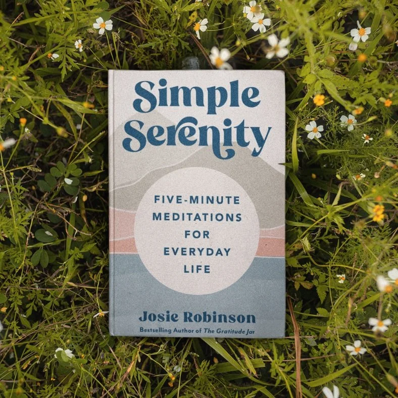Simple Serenity: Five-Minute Meditations for Everyday Life book in grass with flowers