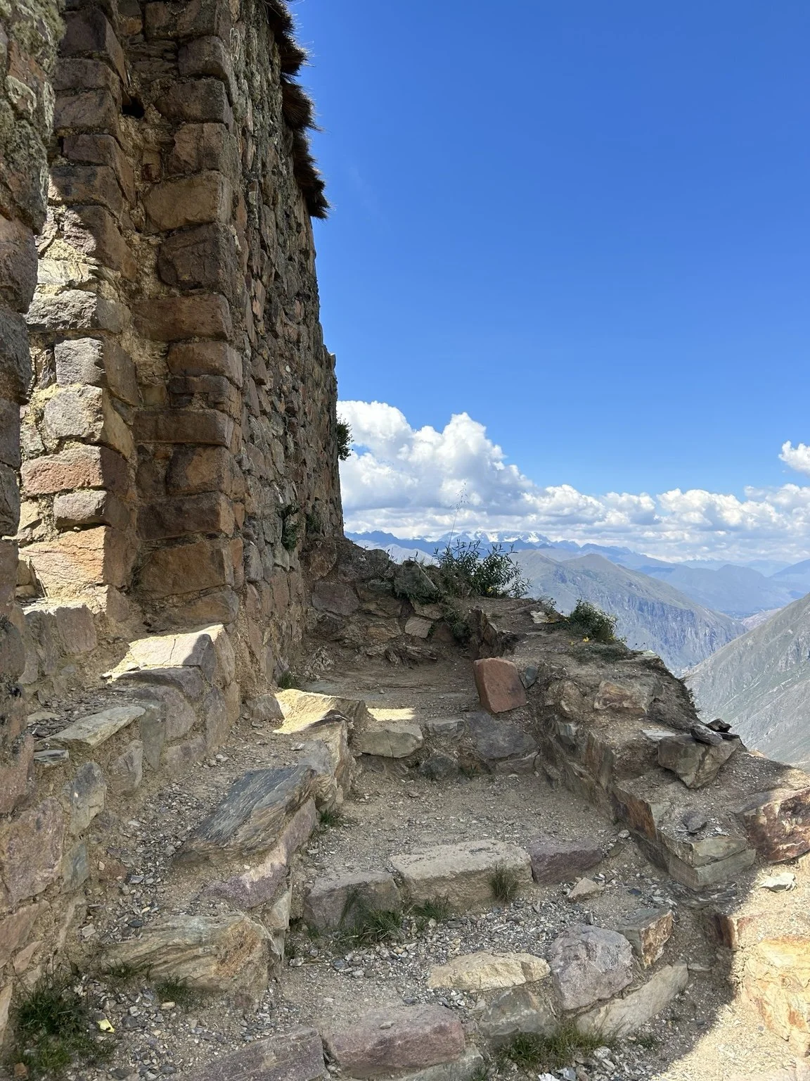Stone ruins overlooking the Andes mountains in Peru.