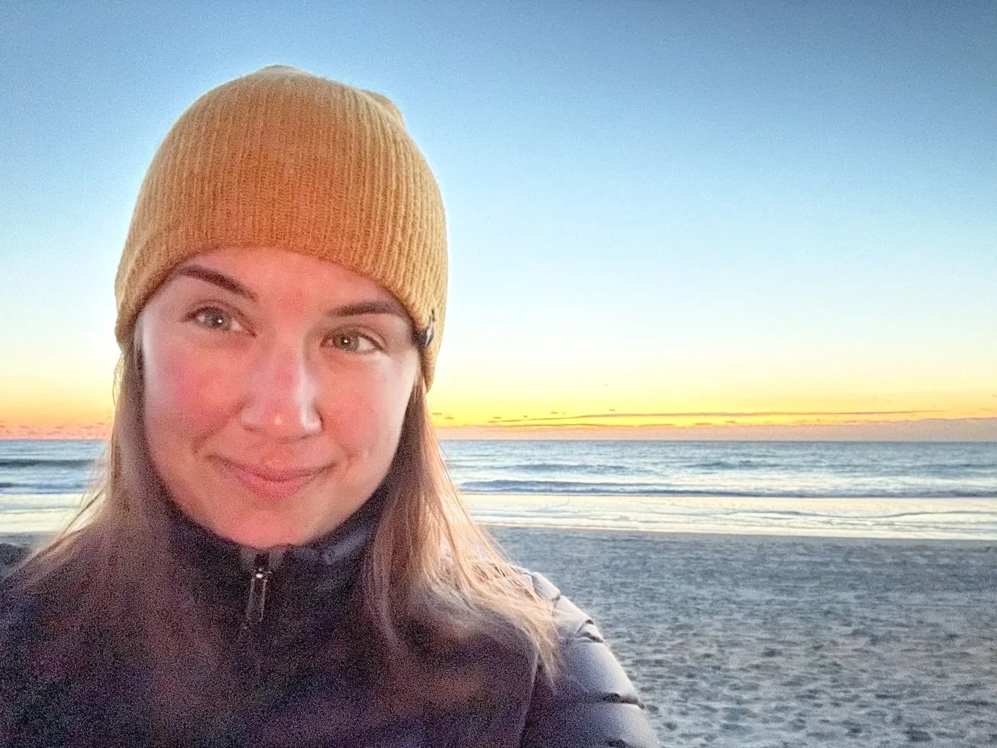 Tonia Johnson at the beach at sunrise..