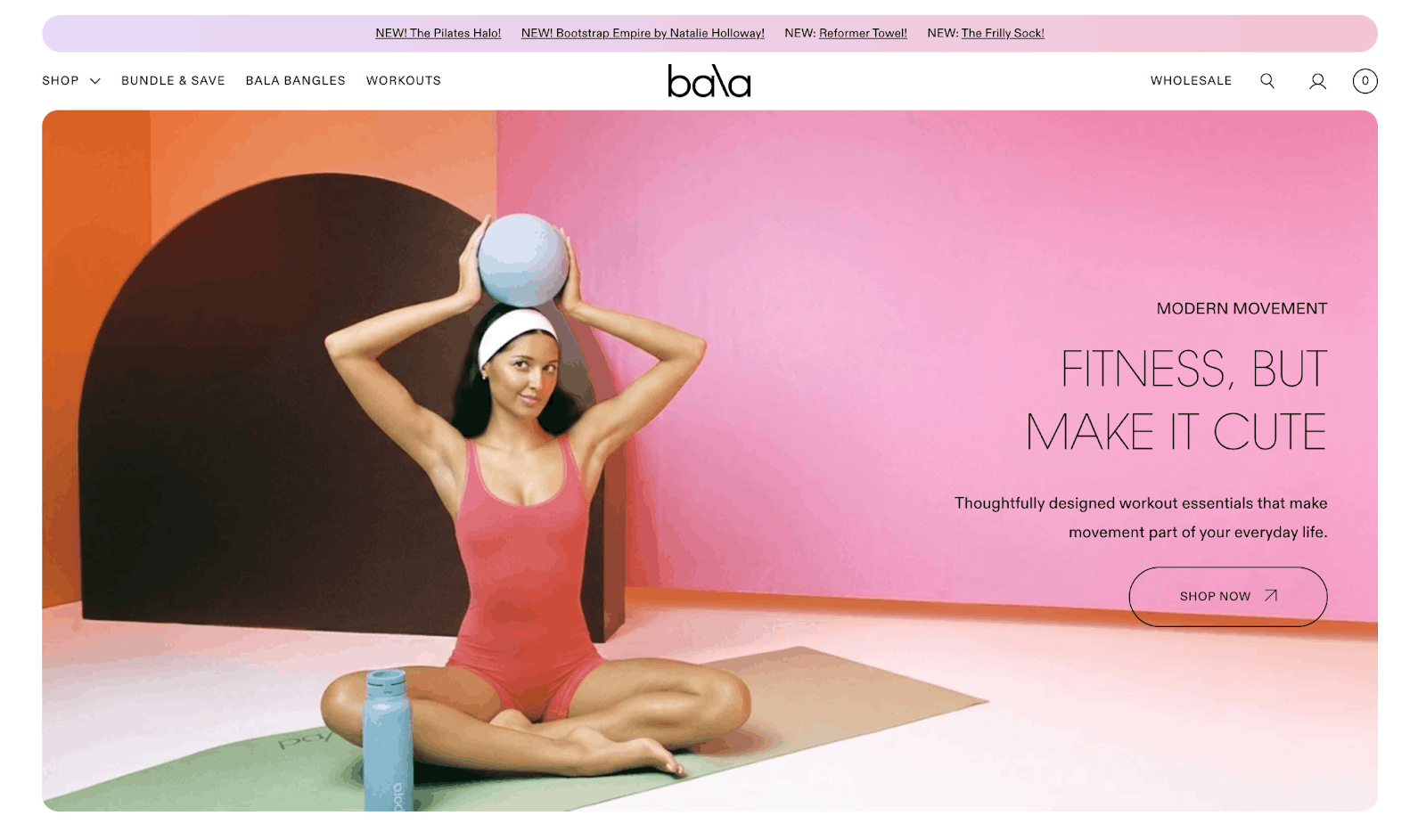 Bala website home page with woman sitting on yoga mat balancing a Bala ball on top of her head.