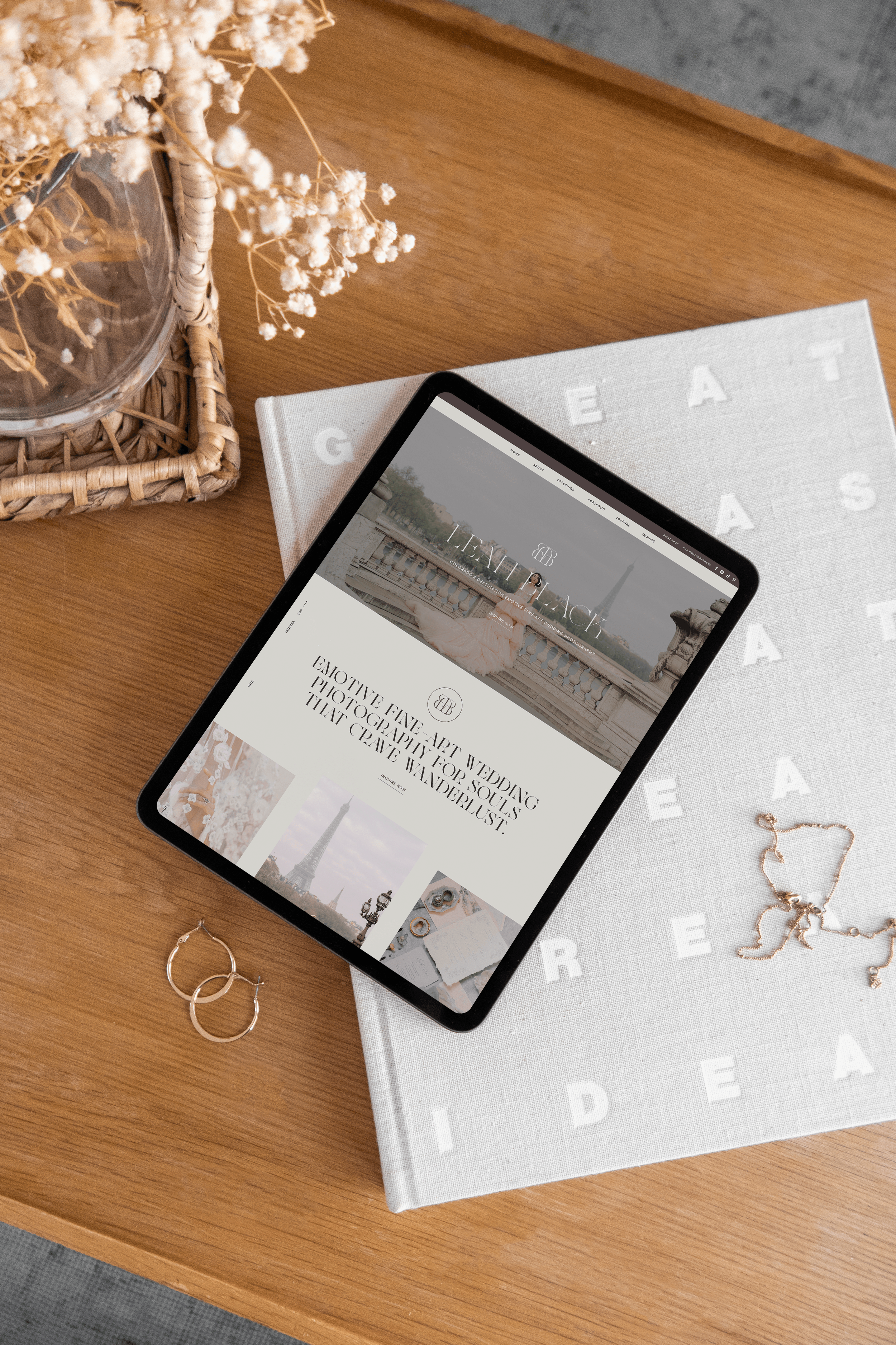 An iPad with Leah Black website home page sitting on a desk.