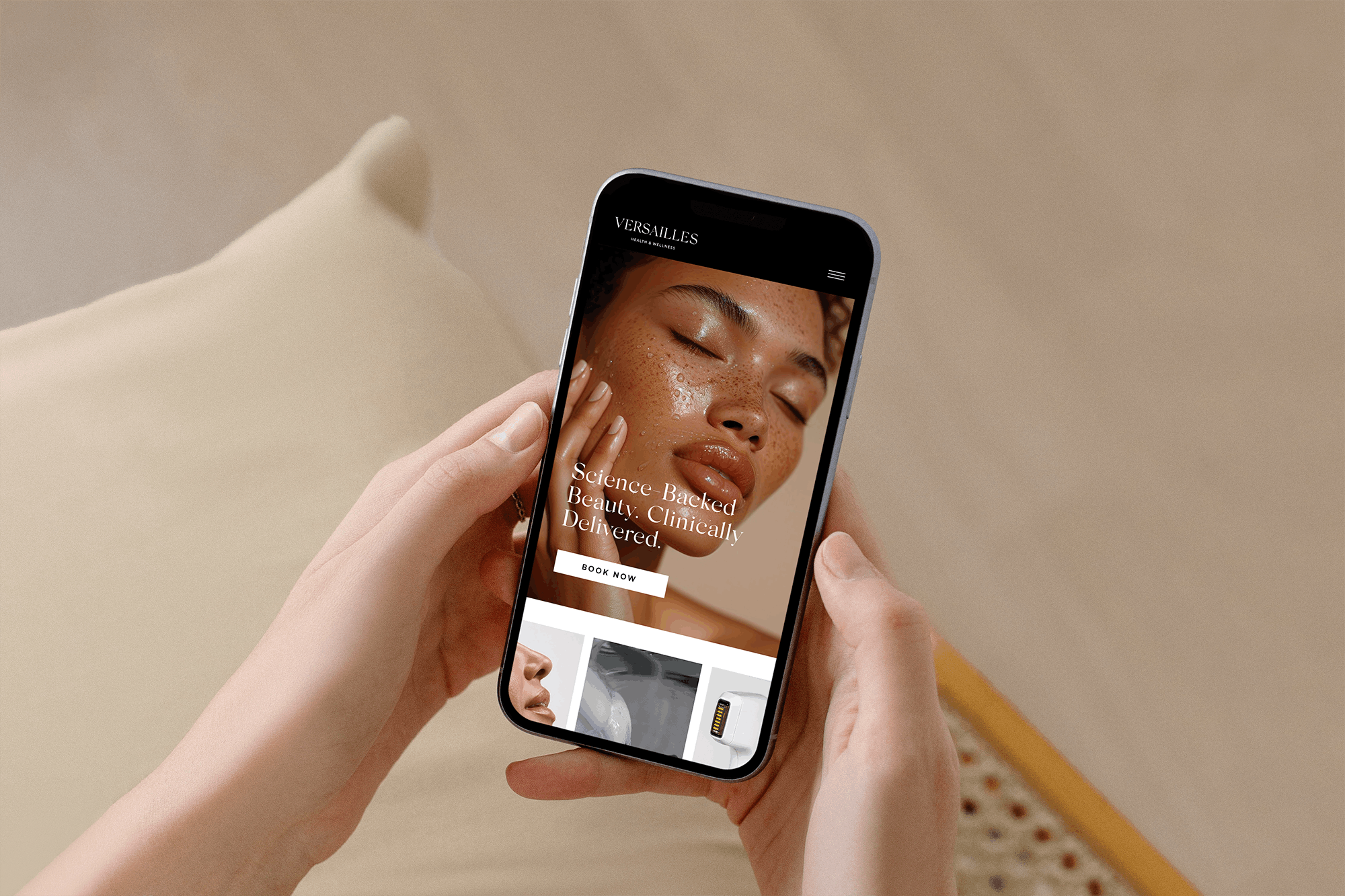 Person holding iPhone with Beauty Website on Screen.