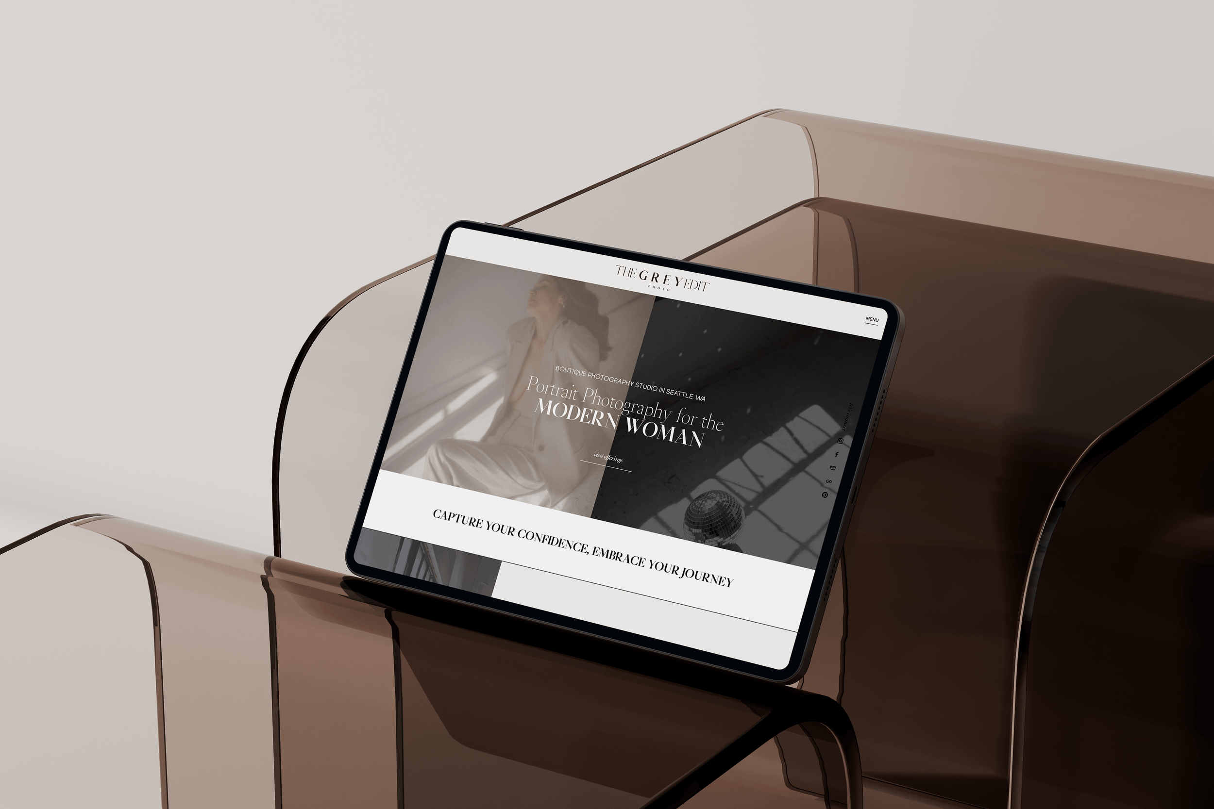 The Grey Edit Homepage on an iPad sitting on a desk.