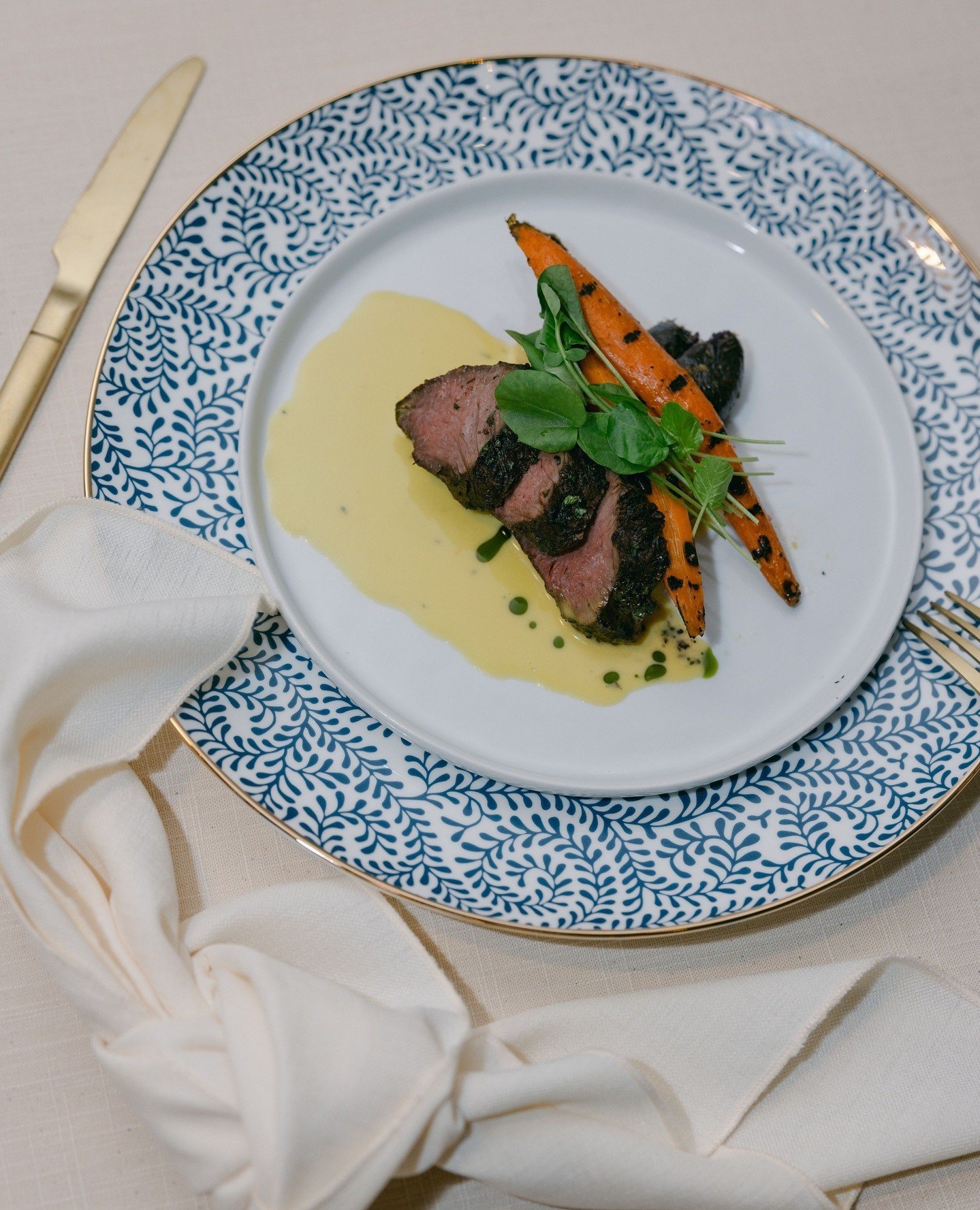 Our Oven Roasted Herb Crusted Hanger Steak served with creamy bearnaise beurre fondue, fresh petite cress, and roasted fingerling potatoes and blistered carrots tossed with zesty citrus, chili flake, garlic chive, and virgin oil is both delicious and