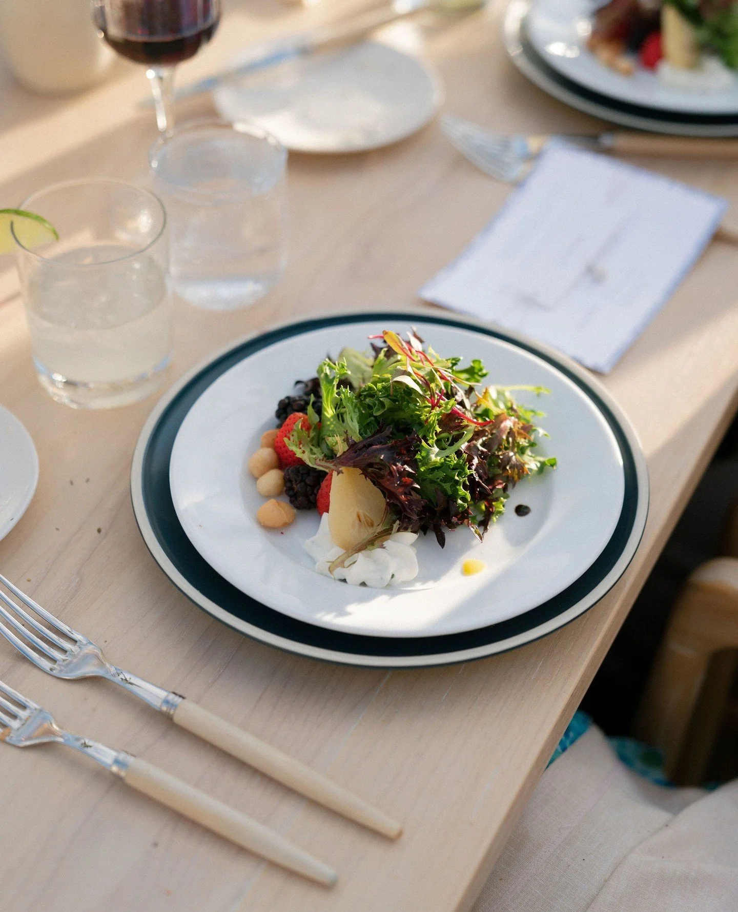 Our Local Organic Greens Salad is anything but ordinary. 🌿✨⁠
⁠
Crisp local greens topped with fresh seasonal berries, creamy goat cheese mousse, caramelized macadamia nuts, and sliced pear - delicately finished with a fig vanilla mist and a viognier