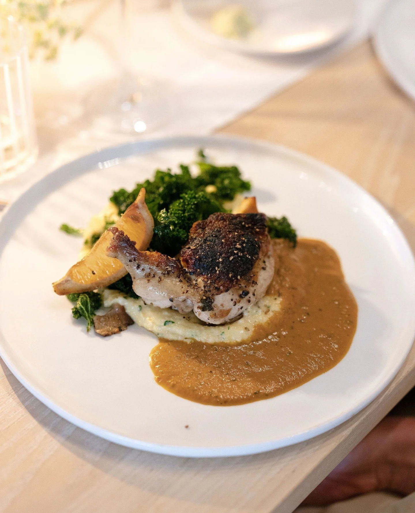 Our Roasted Petaluma Chicken is finished with a sea salt and Tellicherry black pepper crust, fresh garden herbs, natural jus, and paired with soft goat cheese polenta and seasonal greens 🥬⁠
⁠
⁠
Planning &amp; Design: @treschicaffairs @racheltreschic