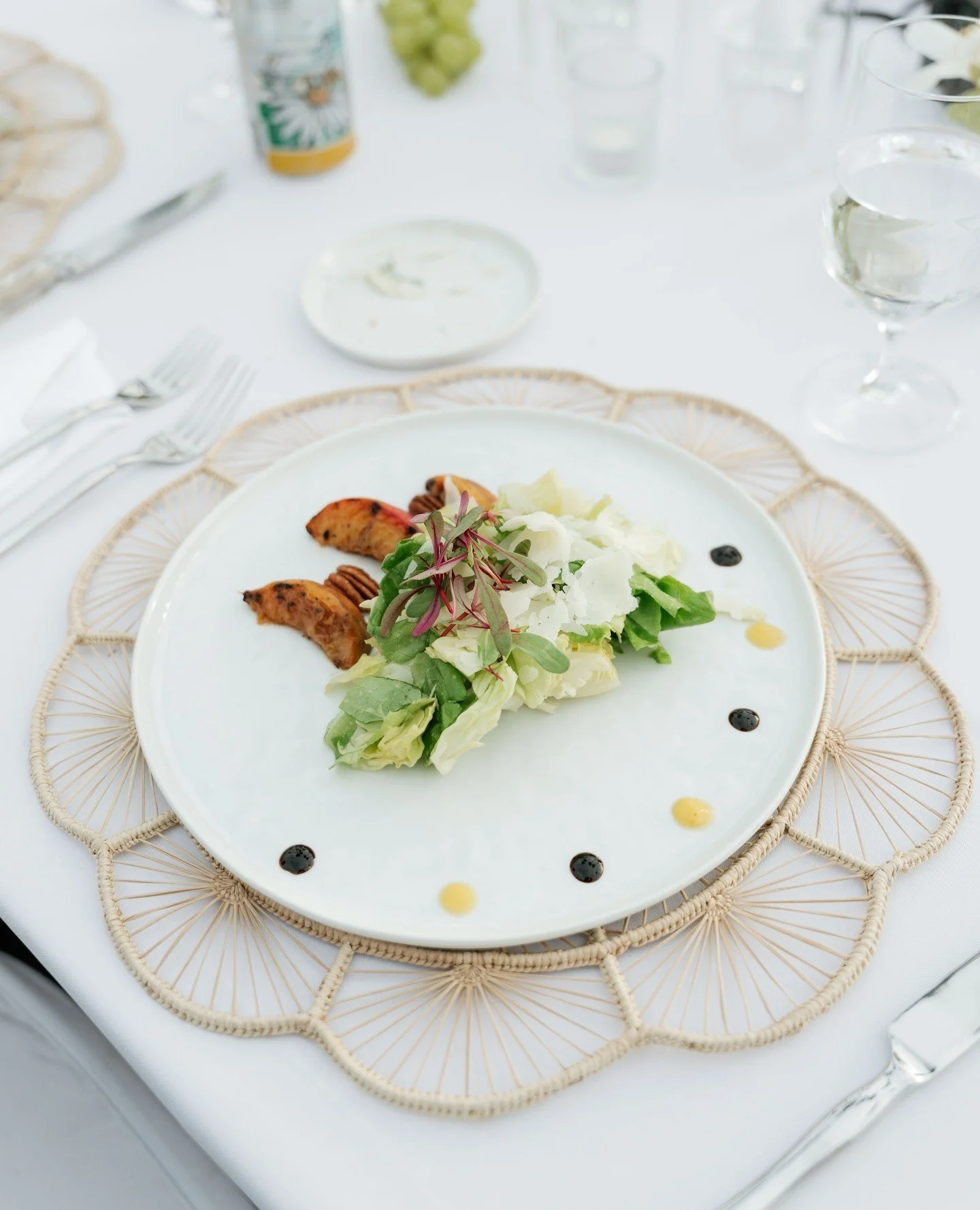 Our Grilled Peach Salad has grilled peaches, buttery greens, Manchego, caramelized pecans, Bull&rsquo;s Blood microgreens and finished with a bright Champagne-Peach vinaigrette... perfect for this summer season 🍑⁠
⁠
⁠
Venue: Scripps Seaside Forum⁠
P