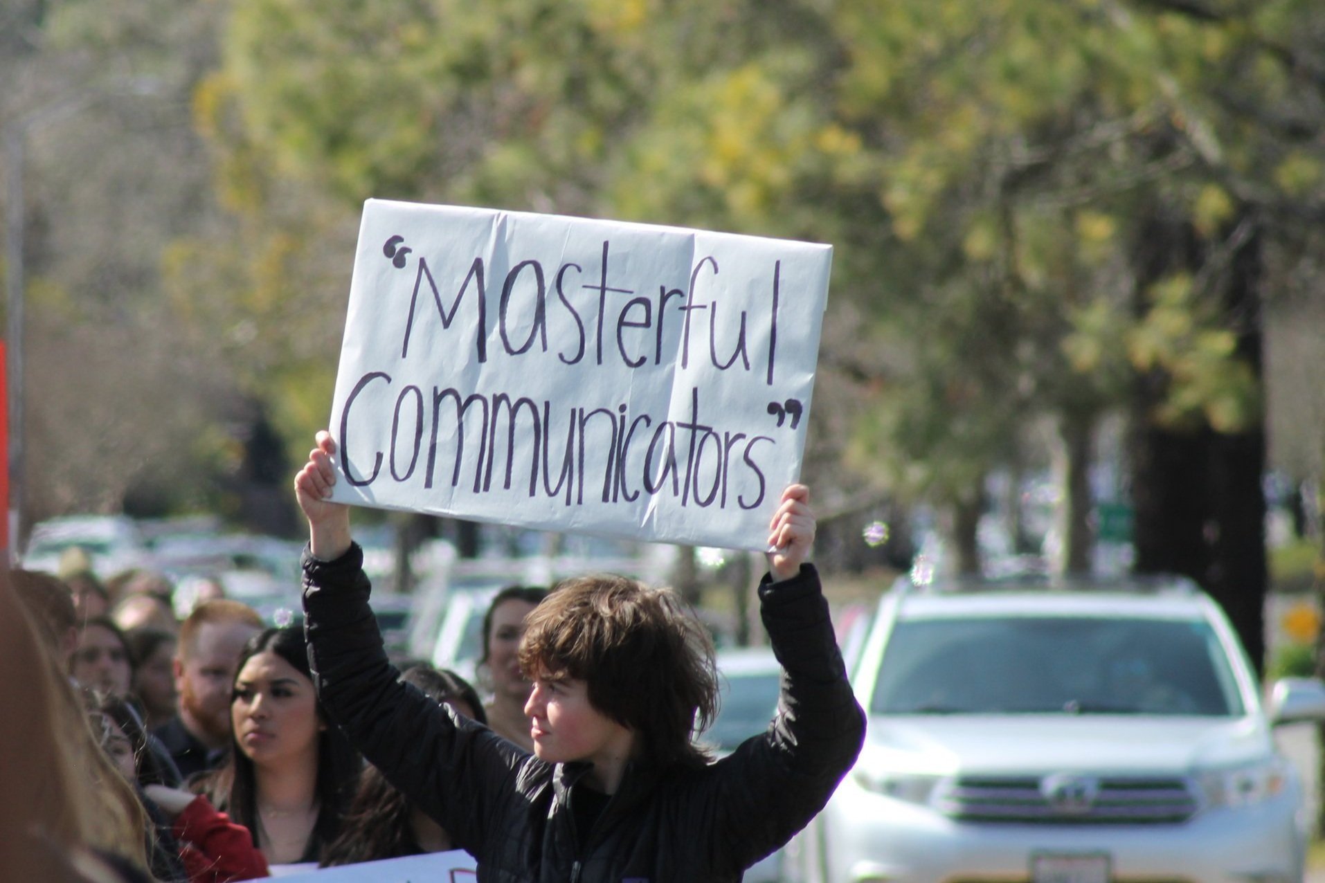  Chloe Cunningham with sign during March 3 walkout  (Sean Gubera,  The Puma Prensa ) 