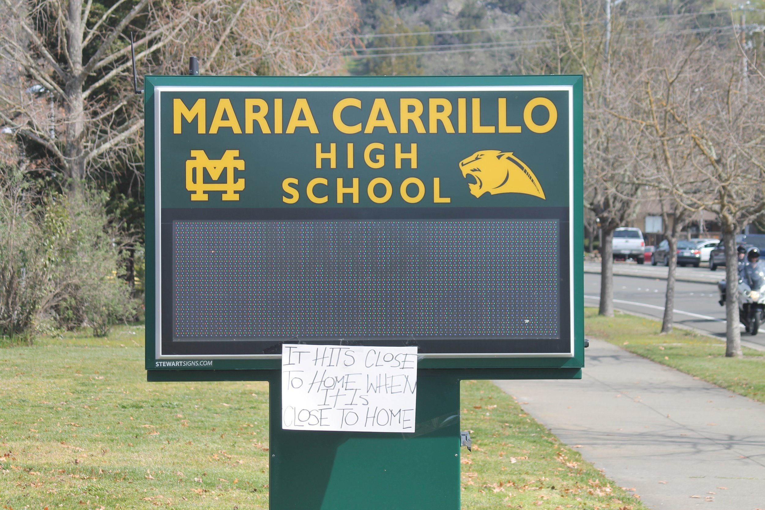  Sign in front of Maria Carrillo during walkout (Sean Gubera,  The Puma Prensa ) 