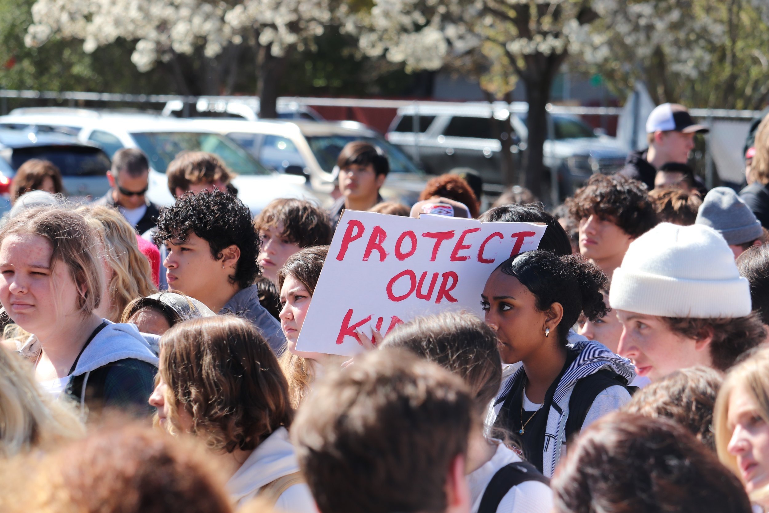  Montgomery High school students at demonstration with signs (Myiah Lucio,  The Puma Prensa  ) 
