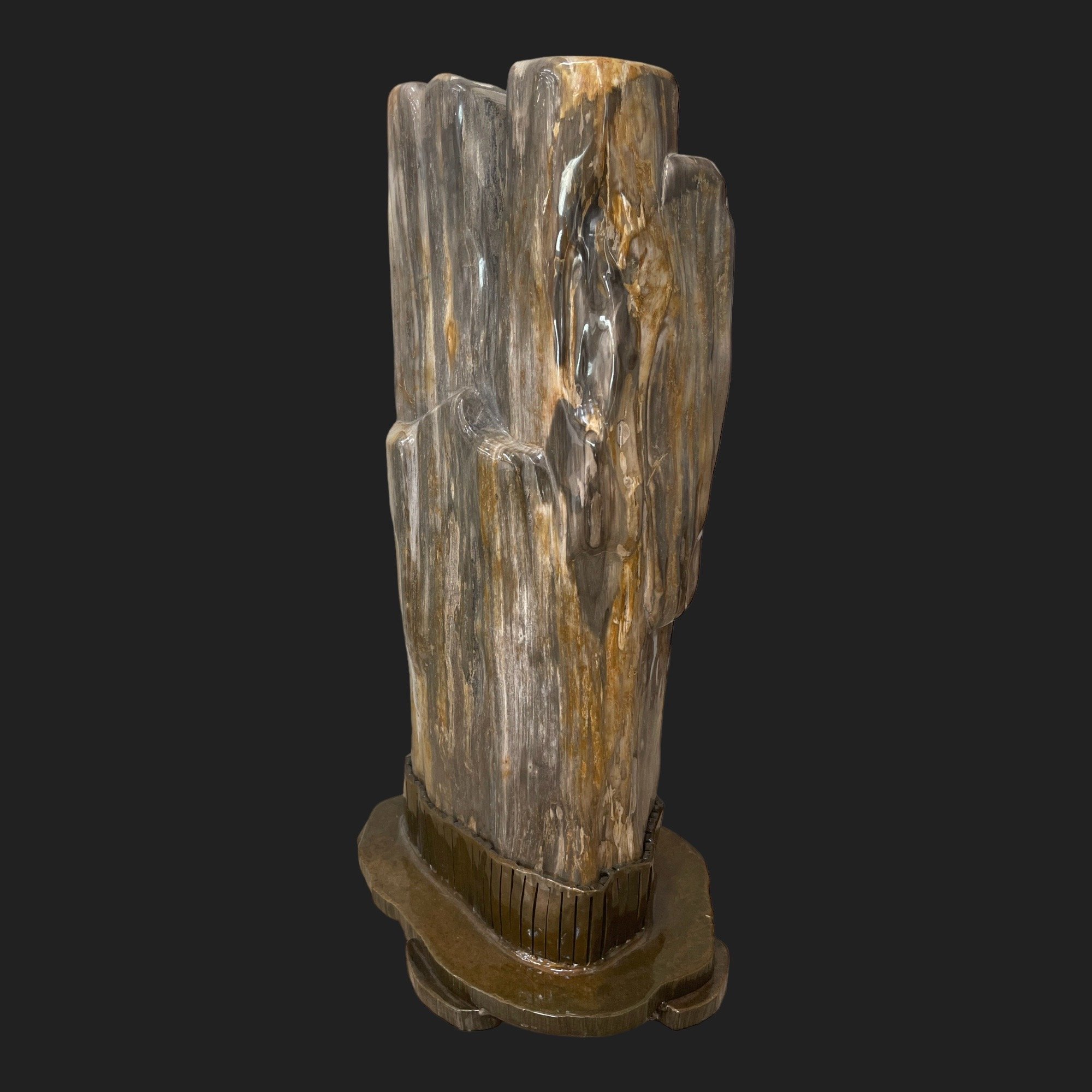 Polished petrified wood fossil sculpture with natural gray and amber striations