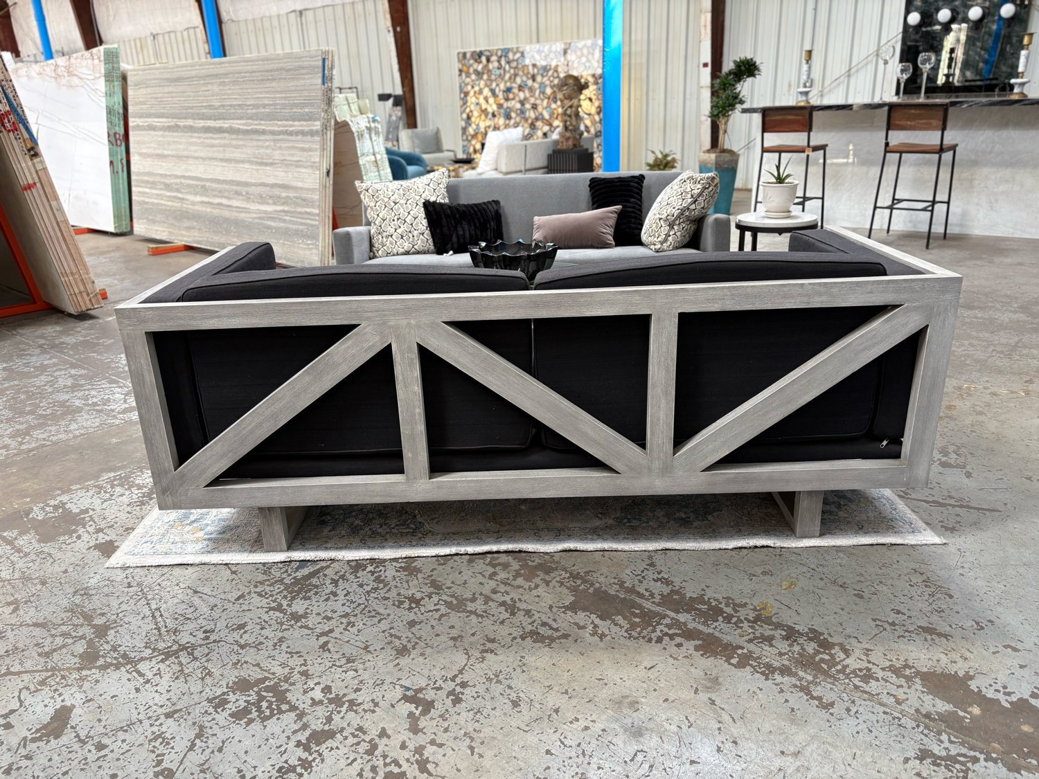 Charcoal sofa with grey wood truss frame and box cushions