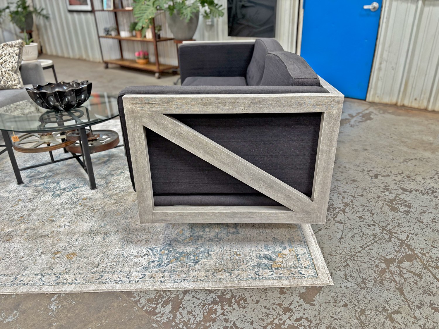 Charcoal sofa with grey wood truss frame and box cushions