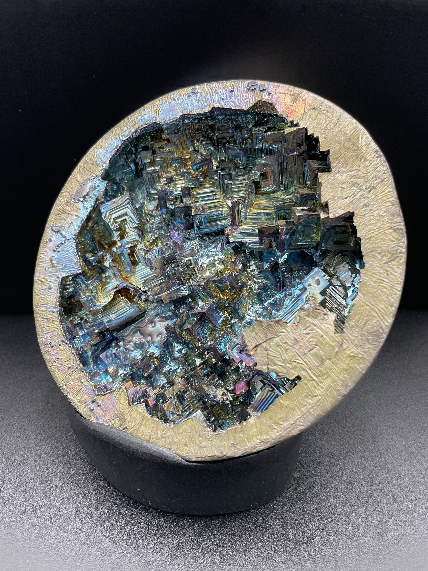 Iridescent bismuth geode sculpture with crystalline structures