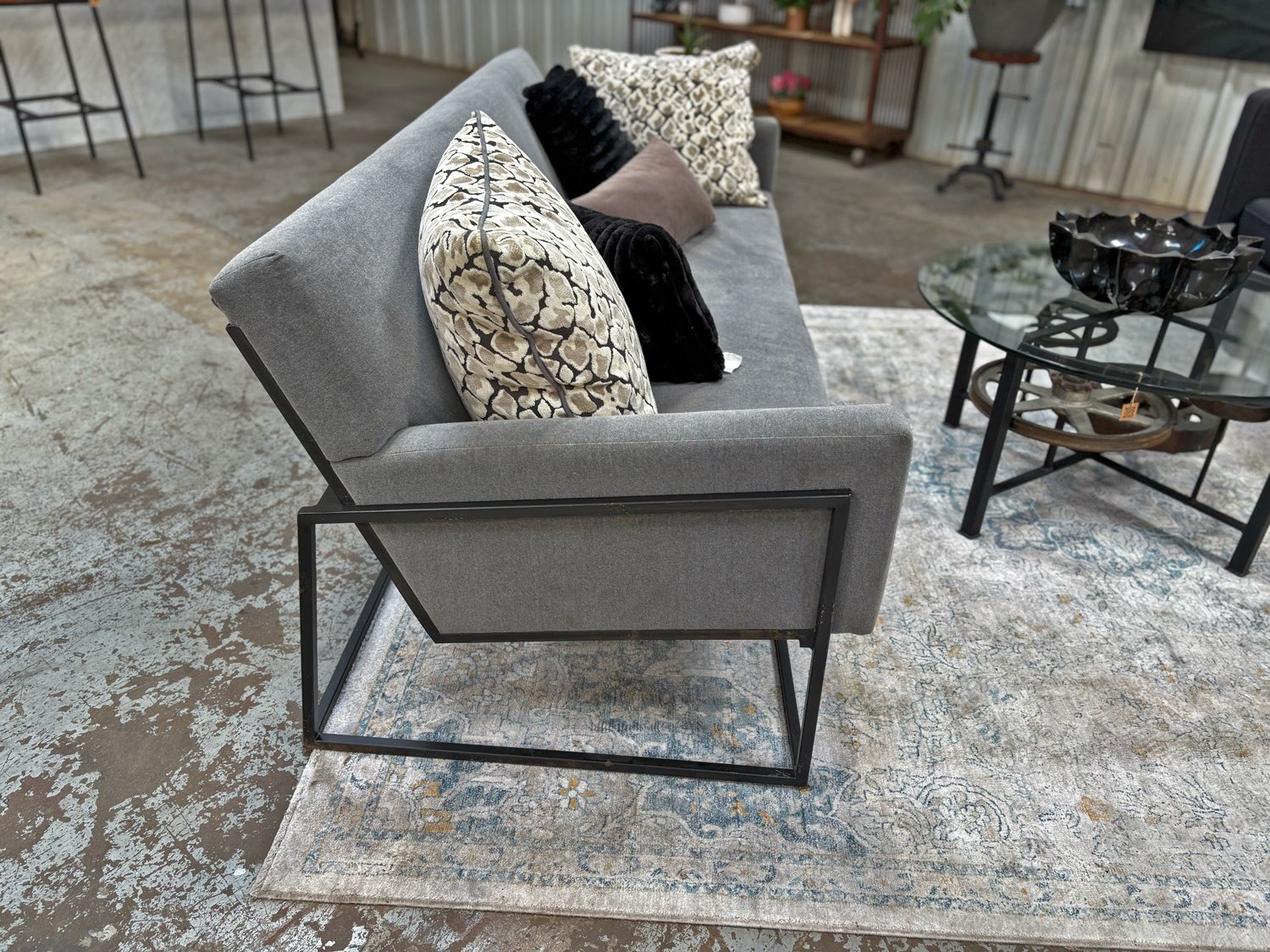 Contemporary grey sofa with black metal sled base, 82-inch wide