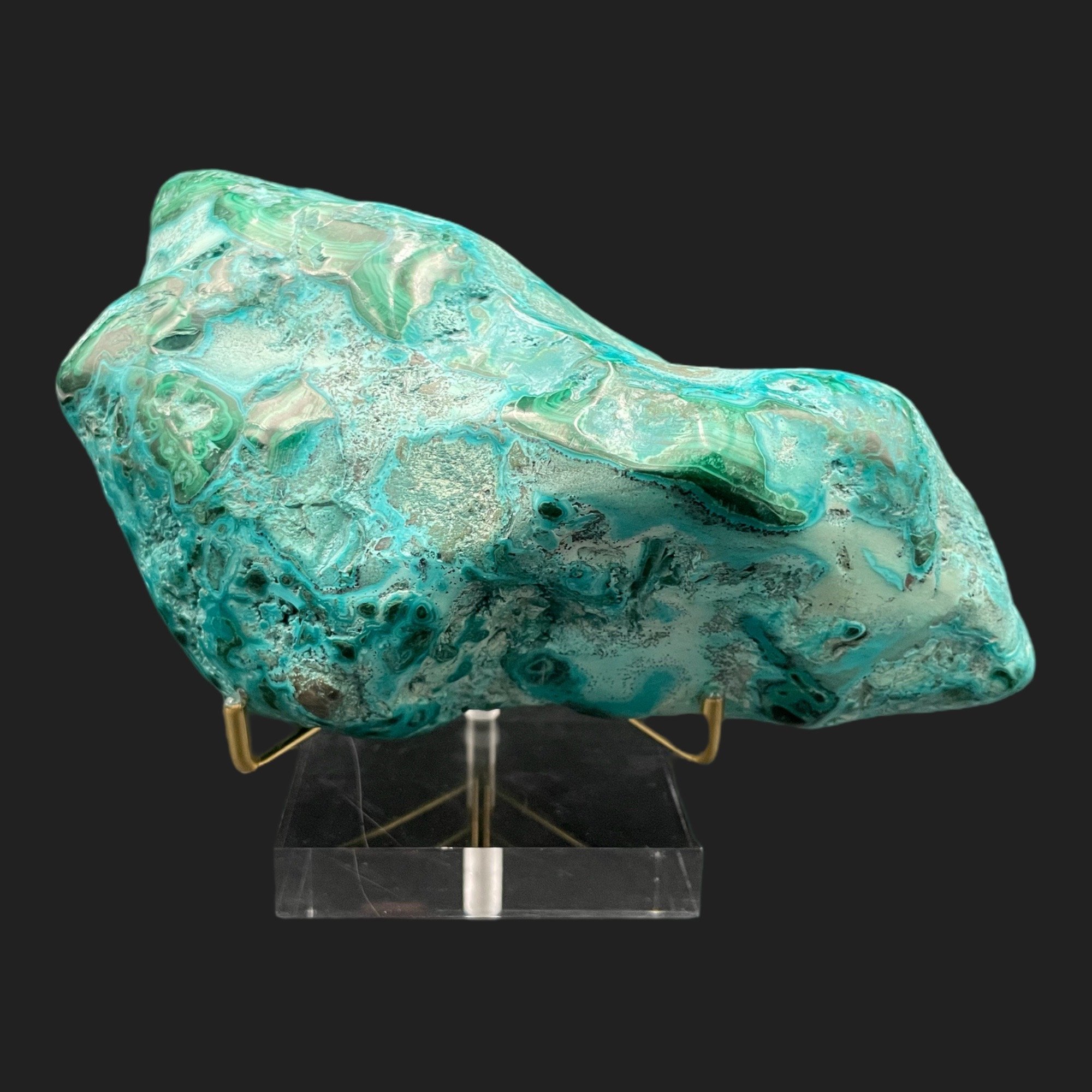 Polished chrysocolla malachite specimen on acrylic stand with swirling turquoise and green patterns