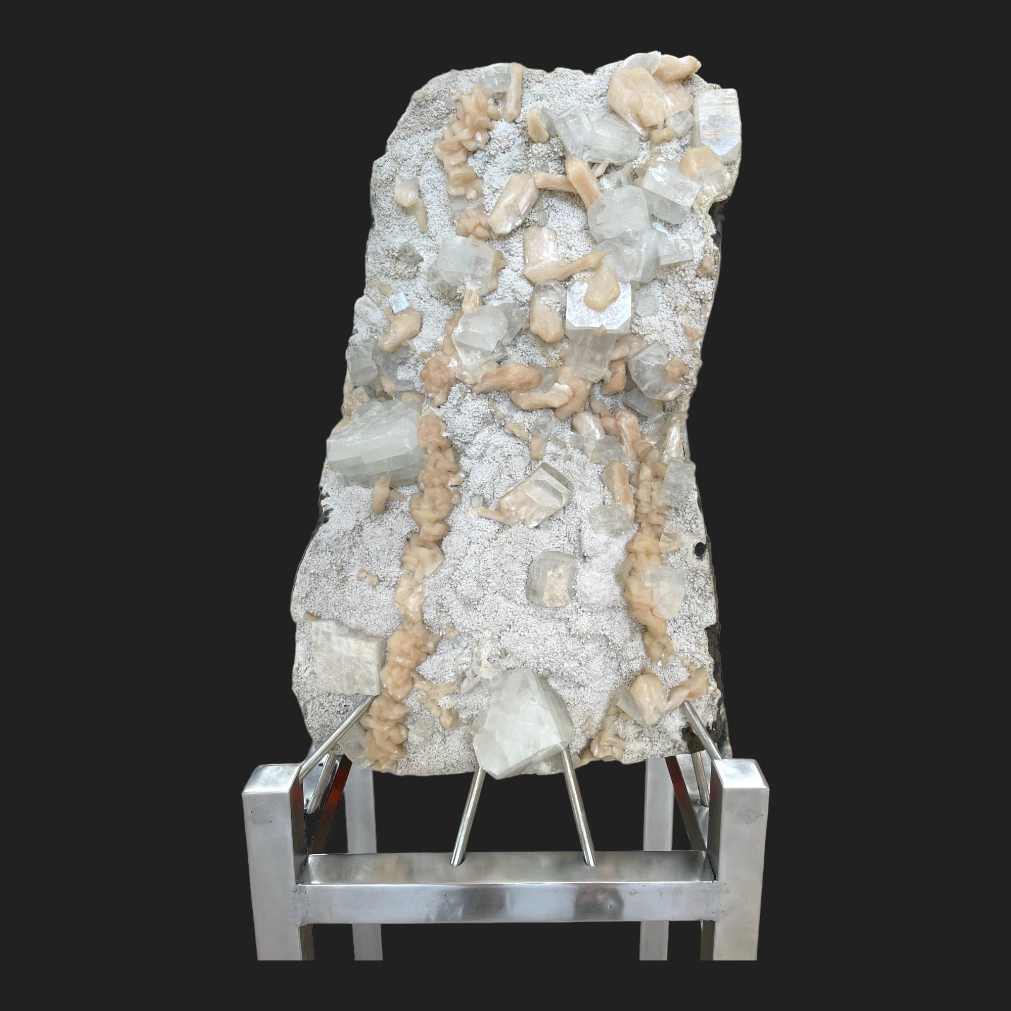 Apophyllite crystal cluster with peach stilbite on a white druzy matrix, mounted on a silver metal base