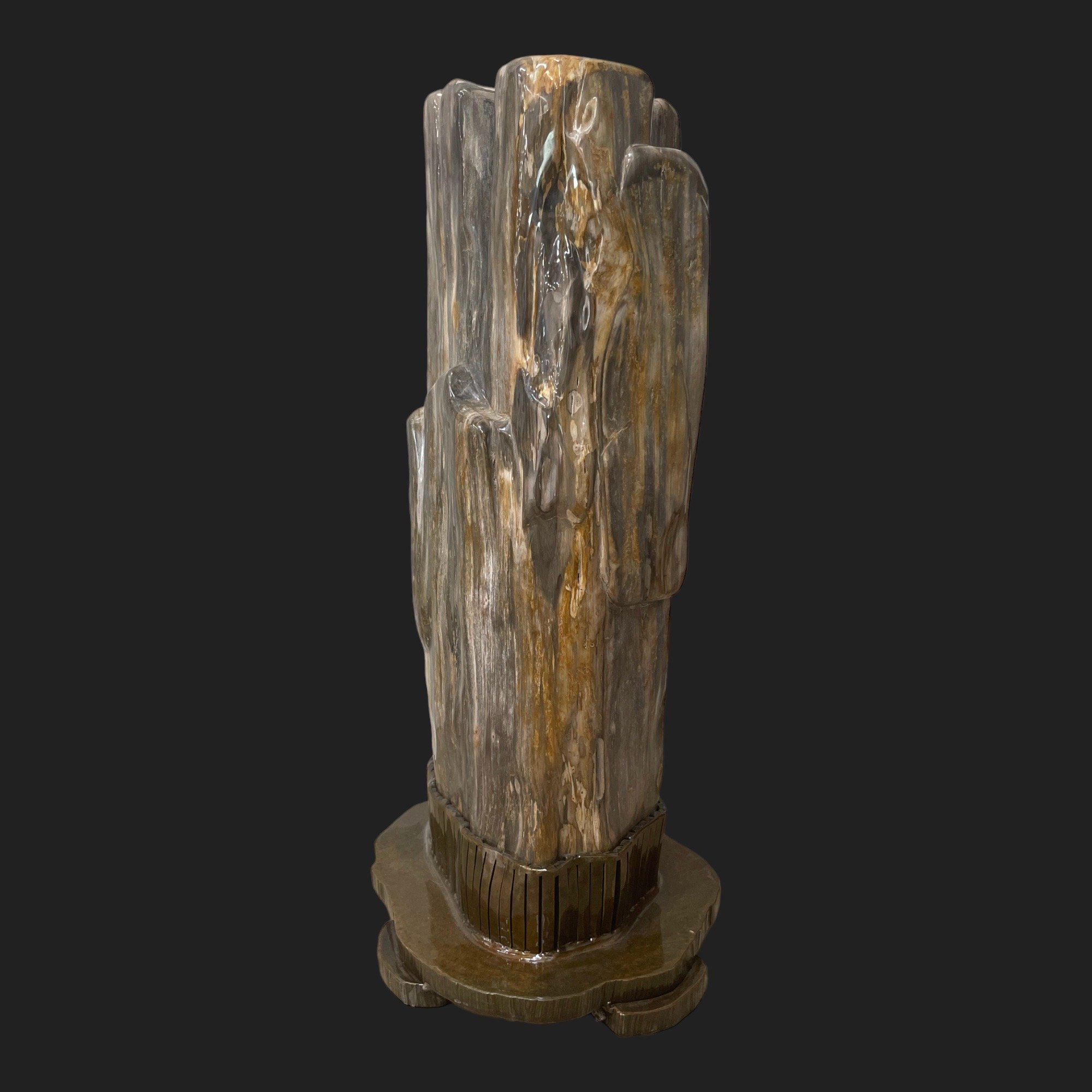 Polished petrified wood fossil sculpture with natural gray and amber striations