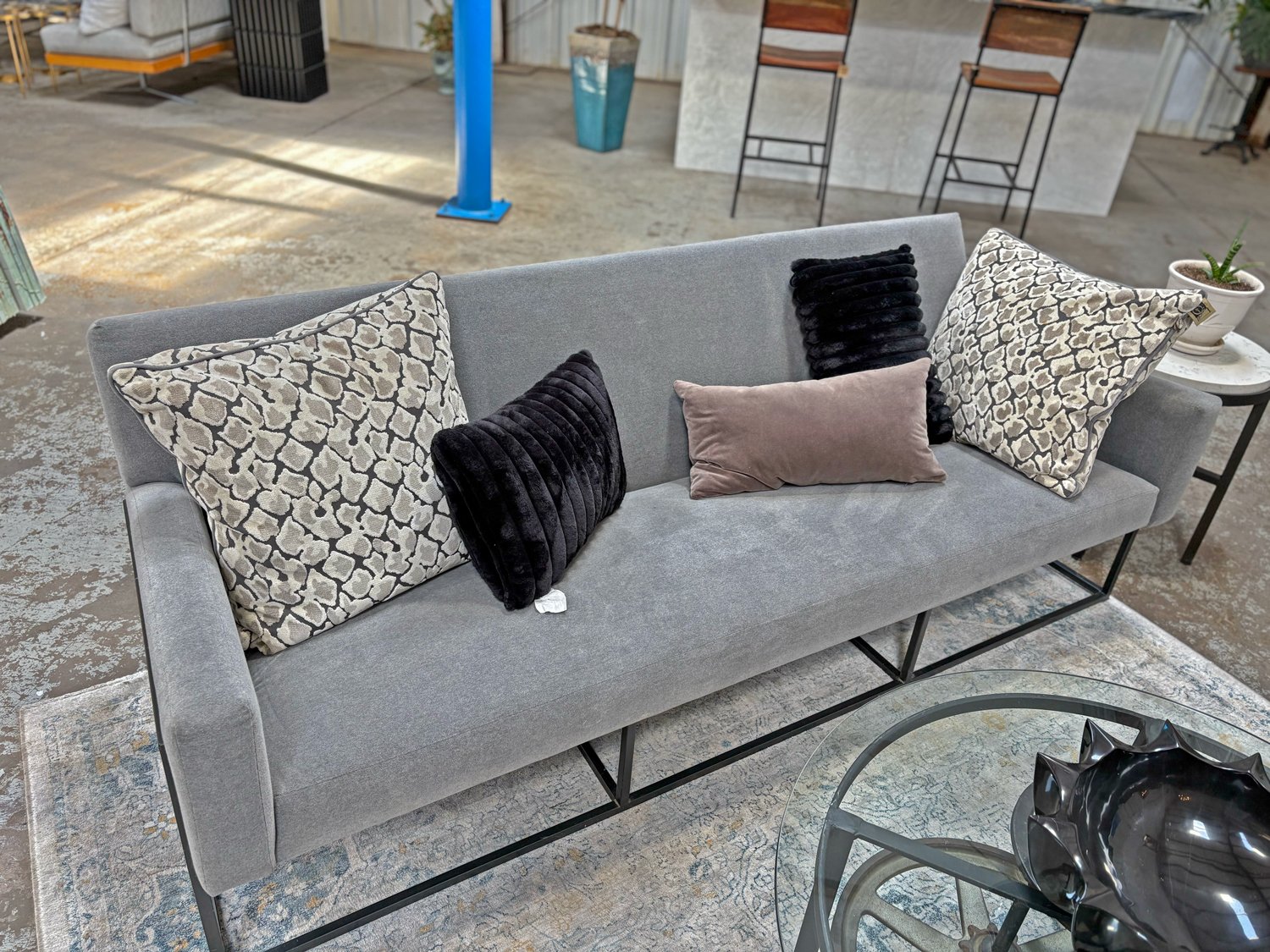 Contemporary grey sofa with black metal sled base, 82-inch wide