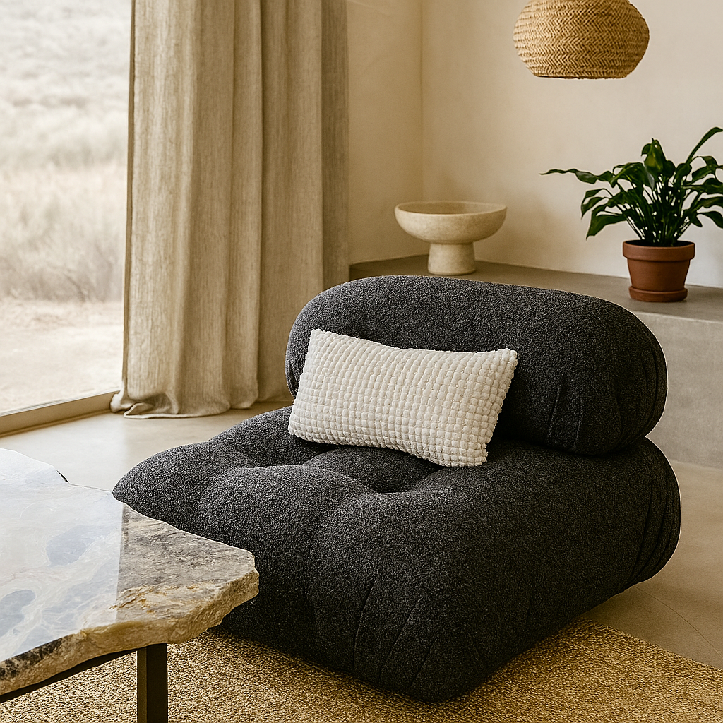 Charcoal Harold Armchair with sculpted tufting and low-slung design